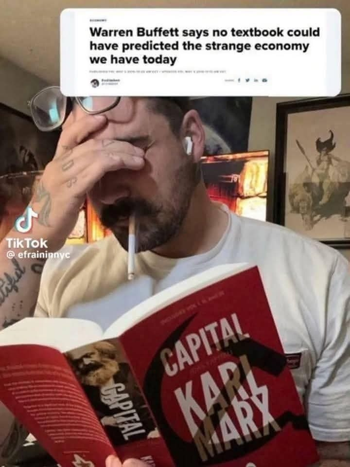 Warren buffet says no textbook  could have predicted the strange economy we have today

Pic of Man sighing rubbing his eyes reading marx