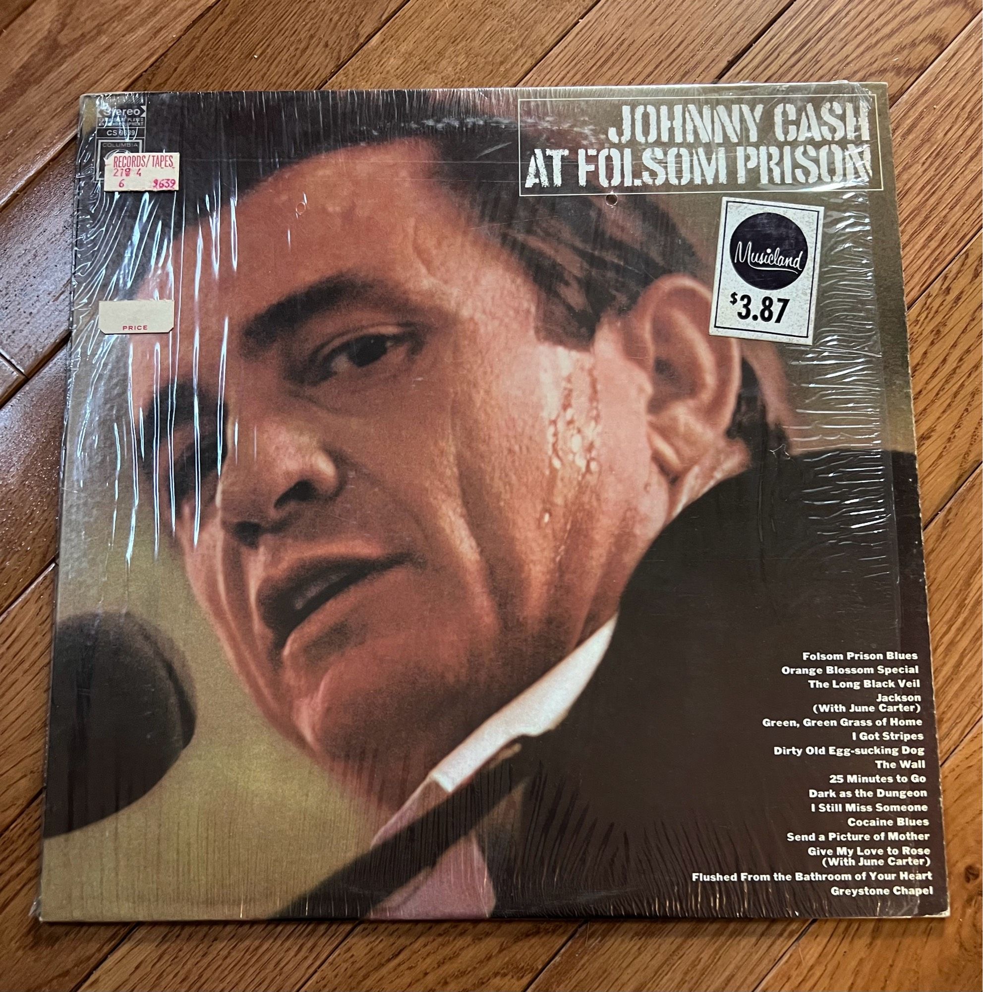 A vinyl copy of Johnny Cash’s AT FOLSOM PRISON, which has a Musicland price tag of $3.87