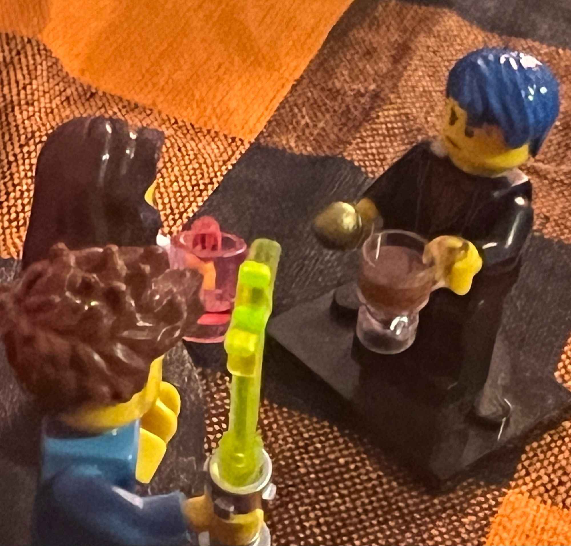 Lego minifigures of Ryan and Courtney being married by a Lego minifigure of me. I have a coffee cup and a microphone, but I don’t drink coffee. Maybe it’s hot chocolate?