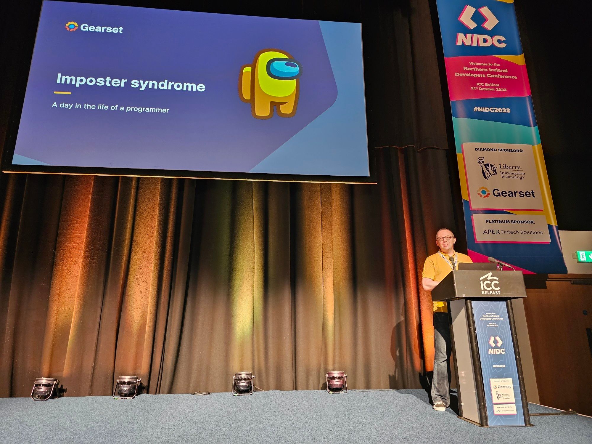 A speaker presenting on Imposter Syndrome