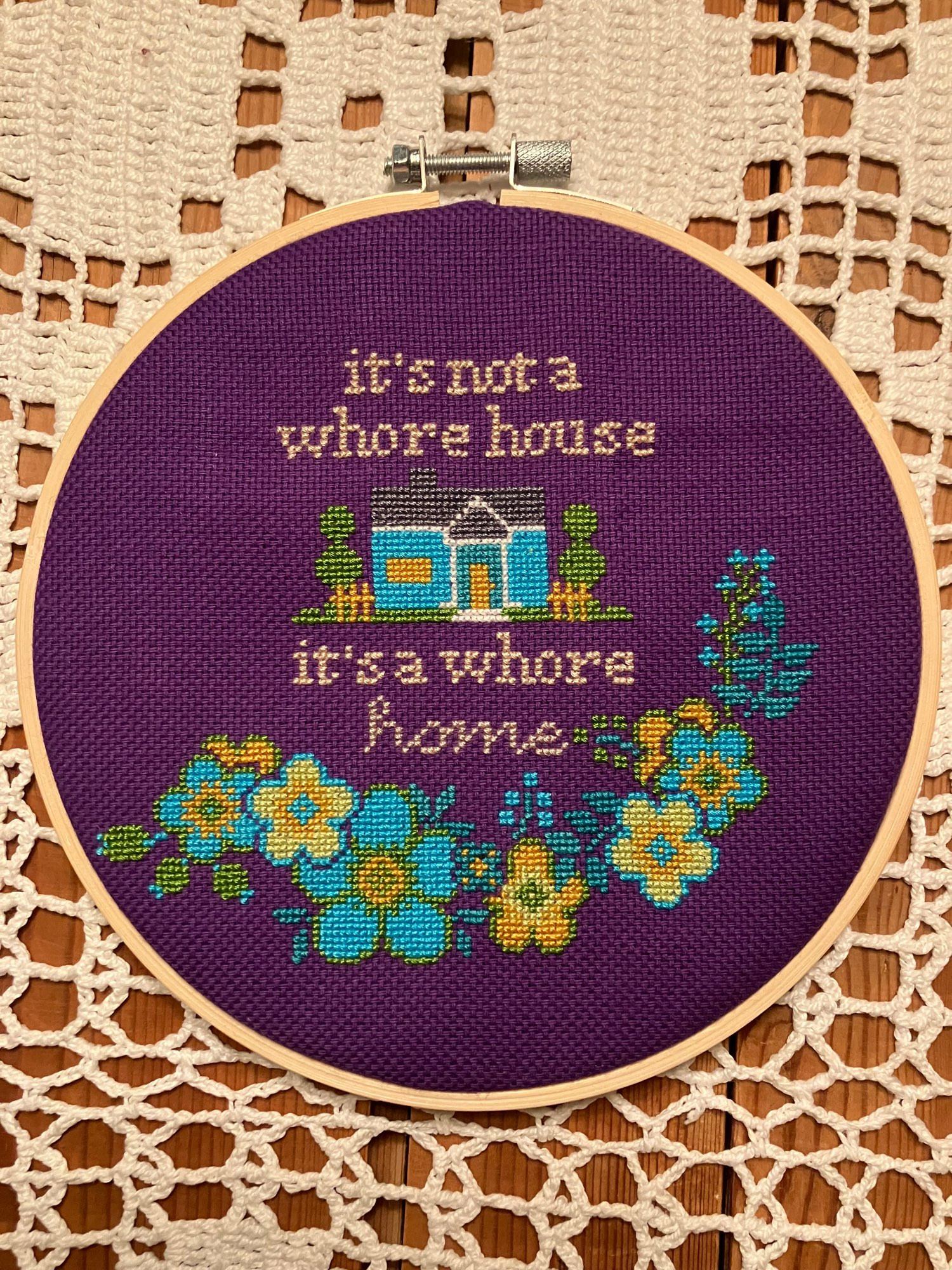 An embroidery made by my friend and ot reads: it’s not a whore house, it’s a whore home.