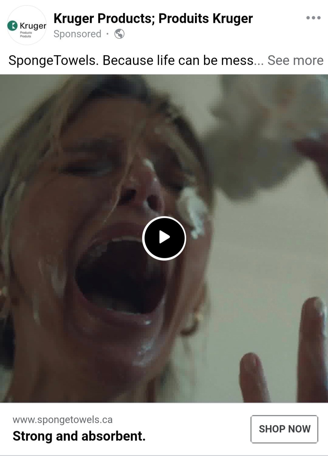 A screencapture of a real Facebook ad for SpongeTowels. In it, a woman's face is covered in white stuff and she is shouting. It looks vaguely inappropriate for family audiences.