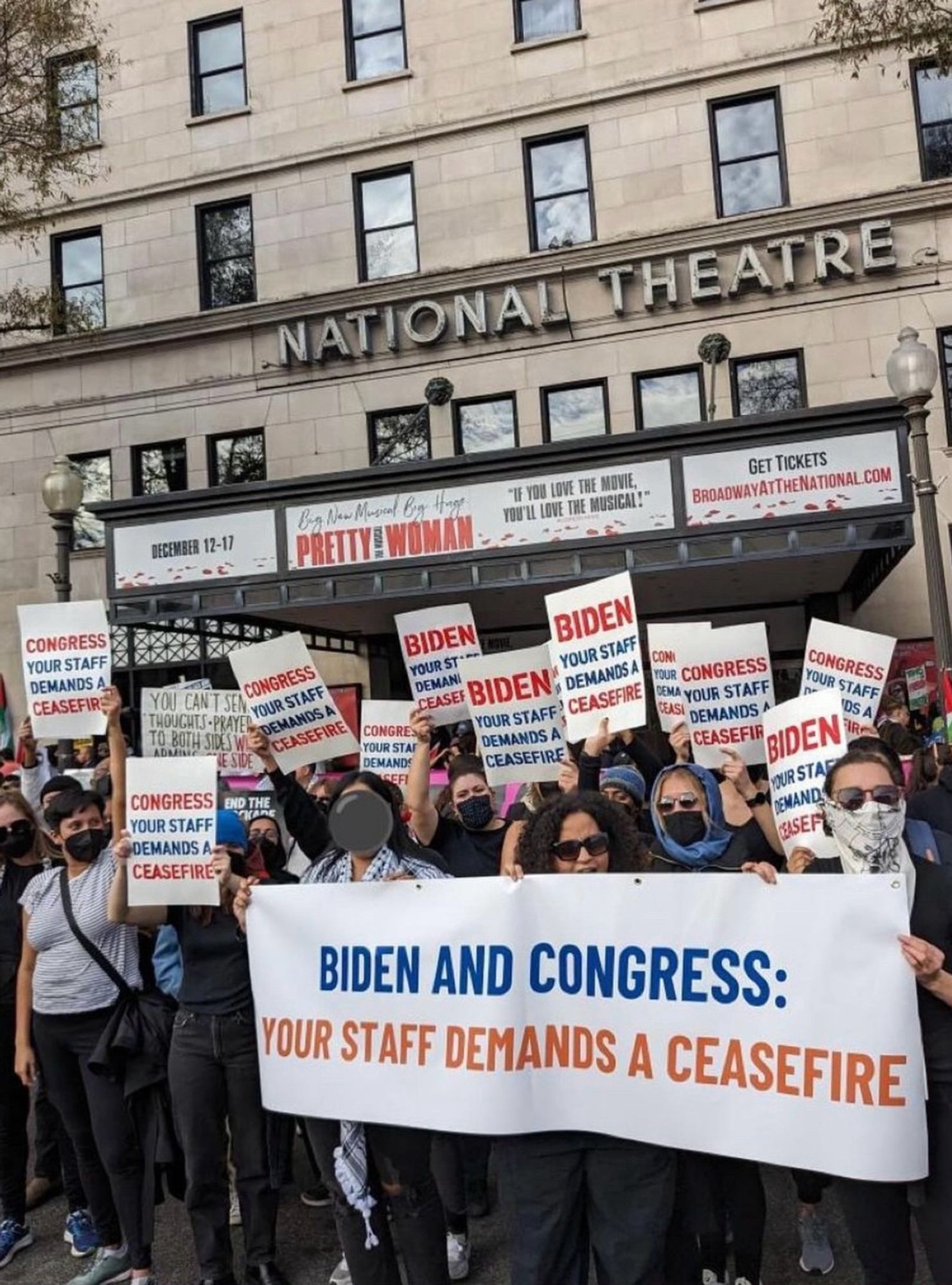 Protestors holding banner that says “Biden and Congress: Your staff demands a ceasefire”