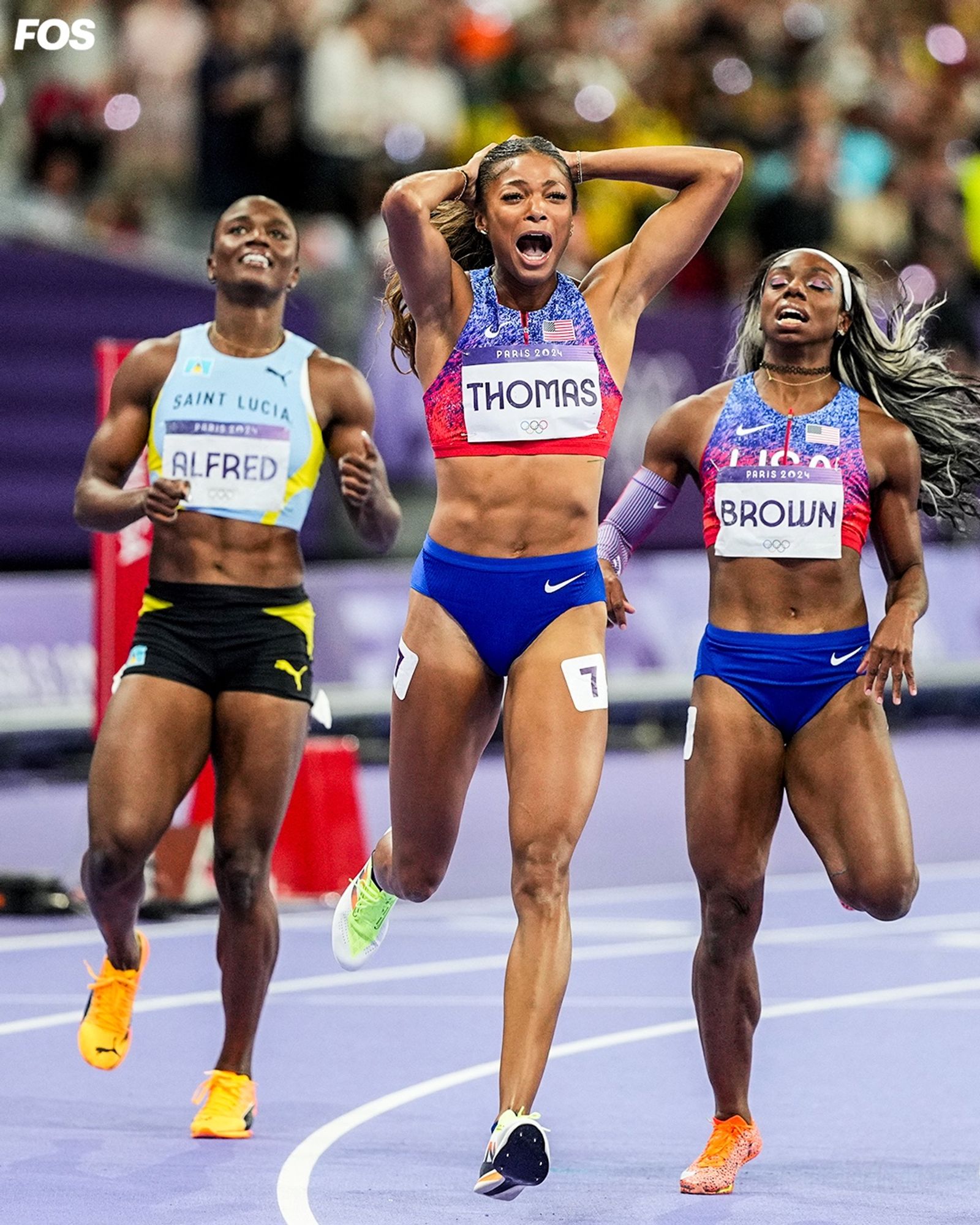 Gabby Thomas celebrates after winning the 200m at the Paris Olympics