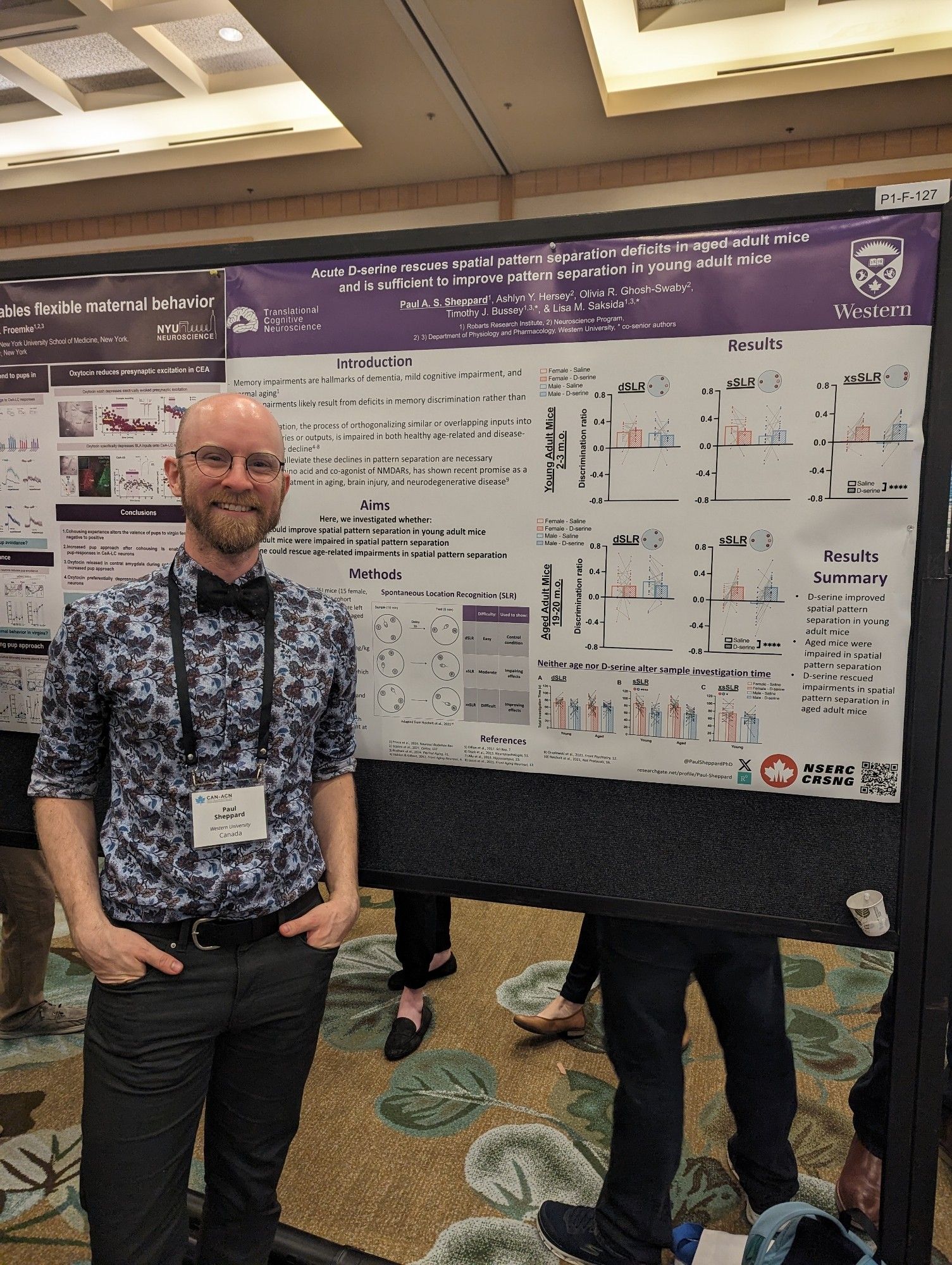 Paul standing by his poster at CAN 2024