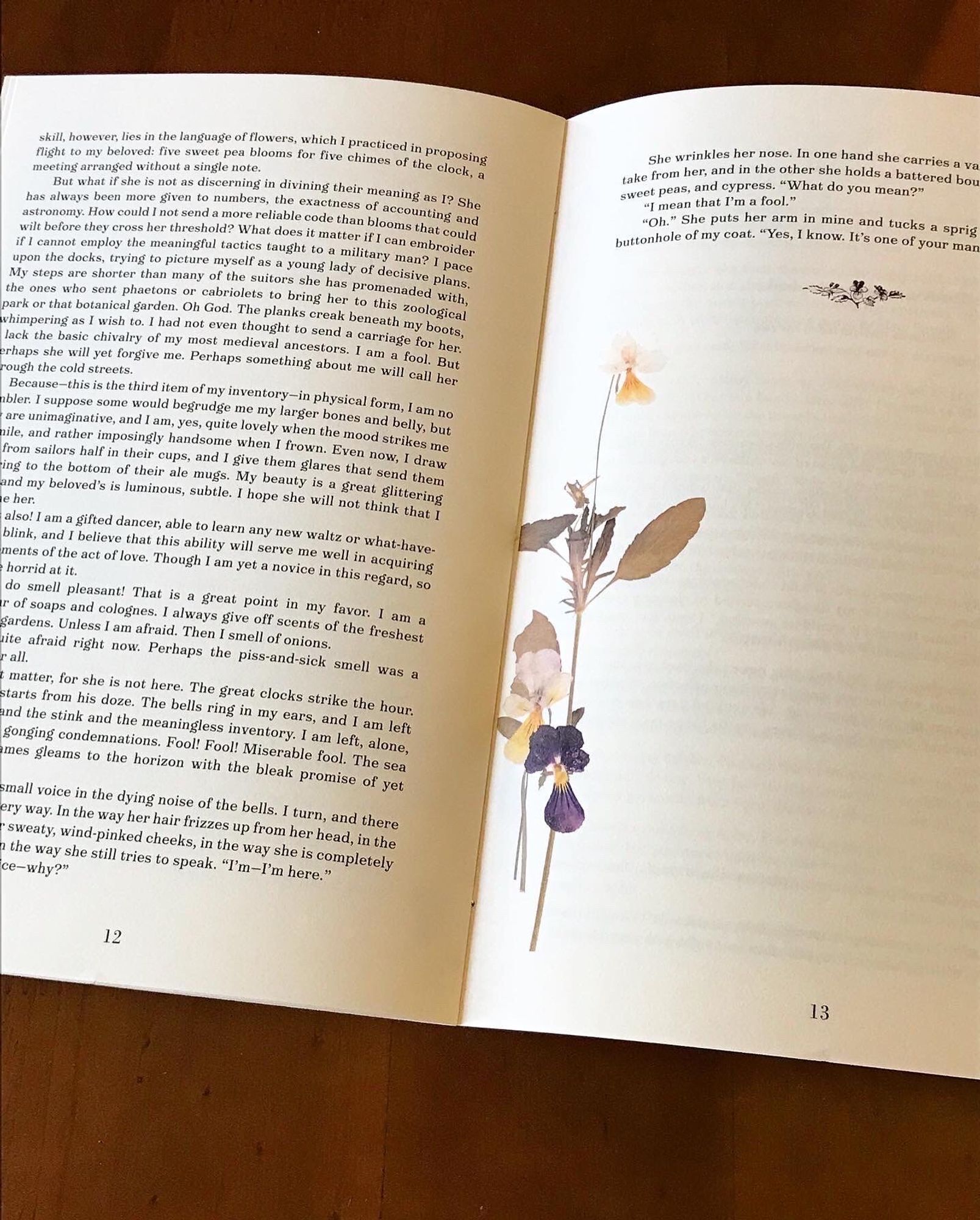 An interior shot of the zine, including more pressed violets near the spine.