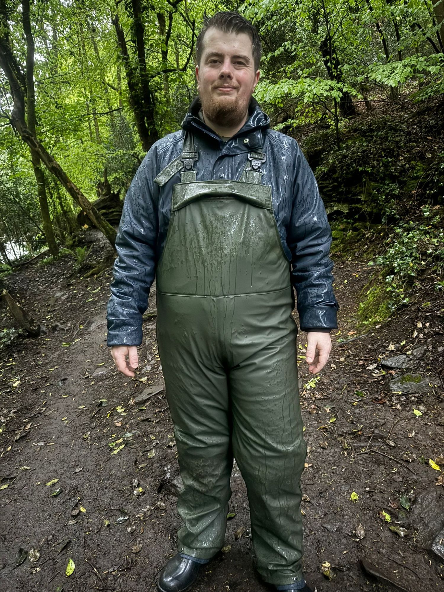 Photo of Pup_Oakley in four waterproof layers, with PVC bib trousers and a waterproof suit