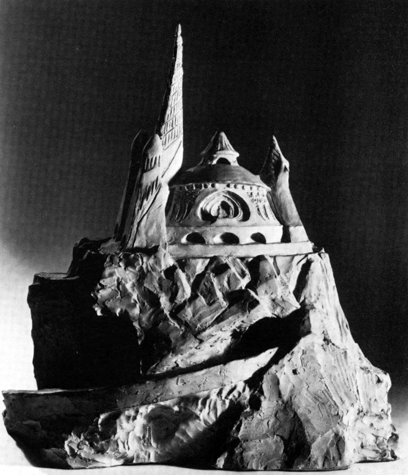 model of a building on a rock.
Looks like something Citadel would have put out in the 80's.
'The Wizards Knob: an exciting diorama for all your FRPG needs'