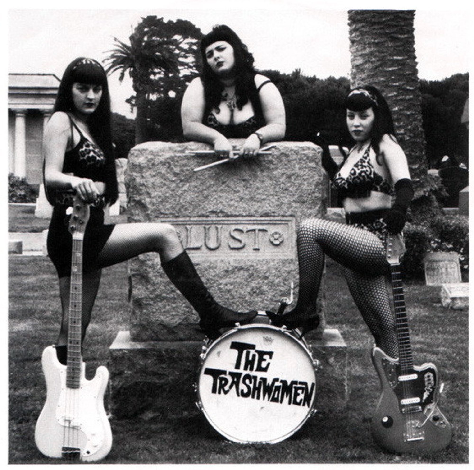 photo
3 women, with drums, bass and guitar, leaning on a grave stone that says Lust.
They are know as The Trashwomen