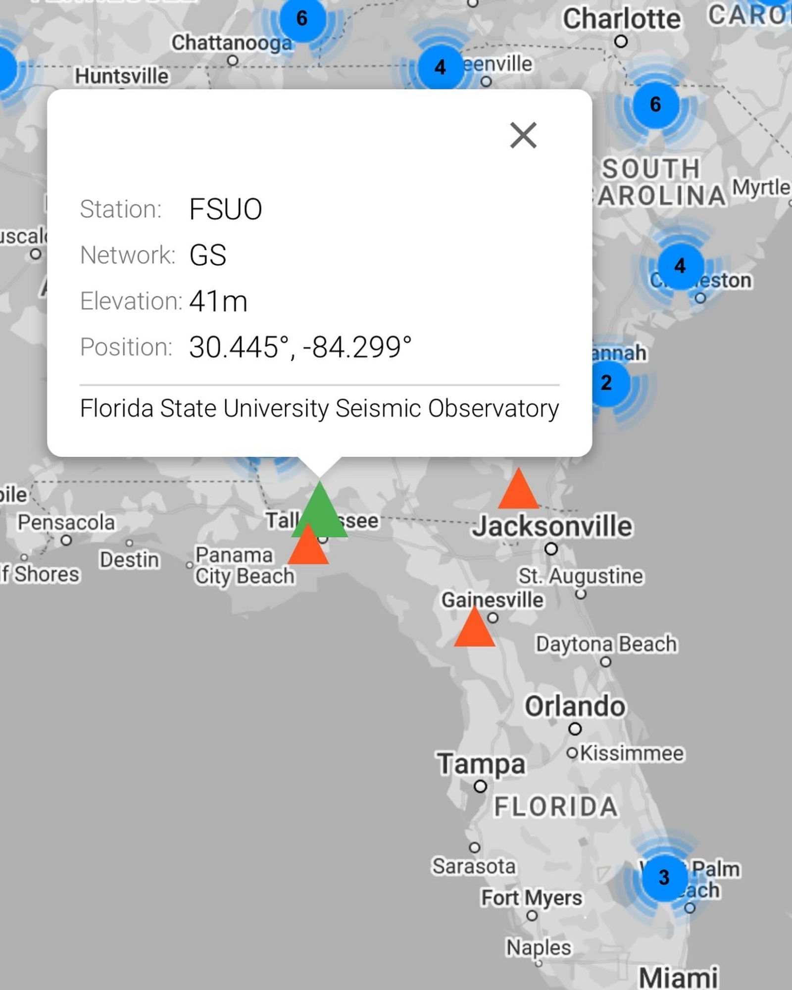 Map of Florida with the location of seismic stations marked in red. The station in Tallahassee is marked with a green triangle.