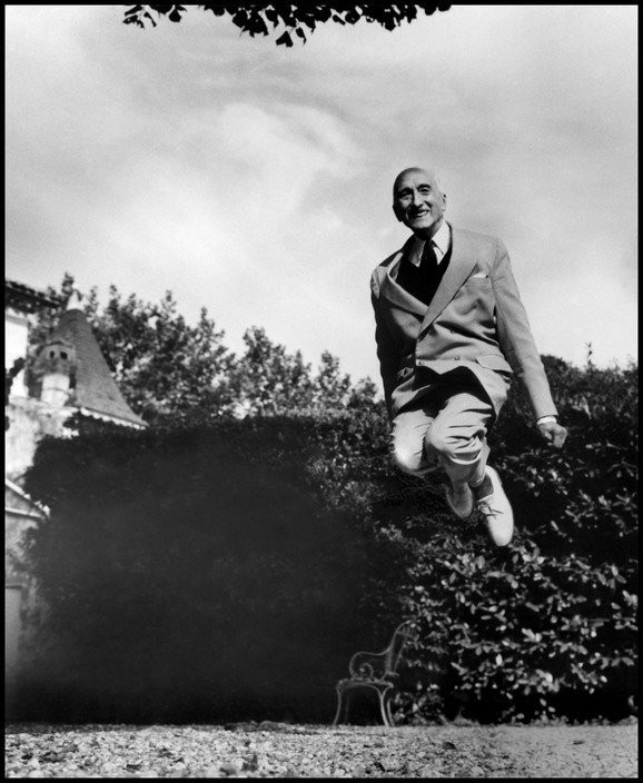 Mauriac smiles for the camera as he leaps impressively high.