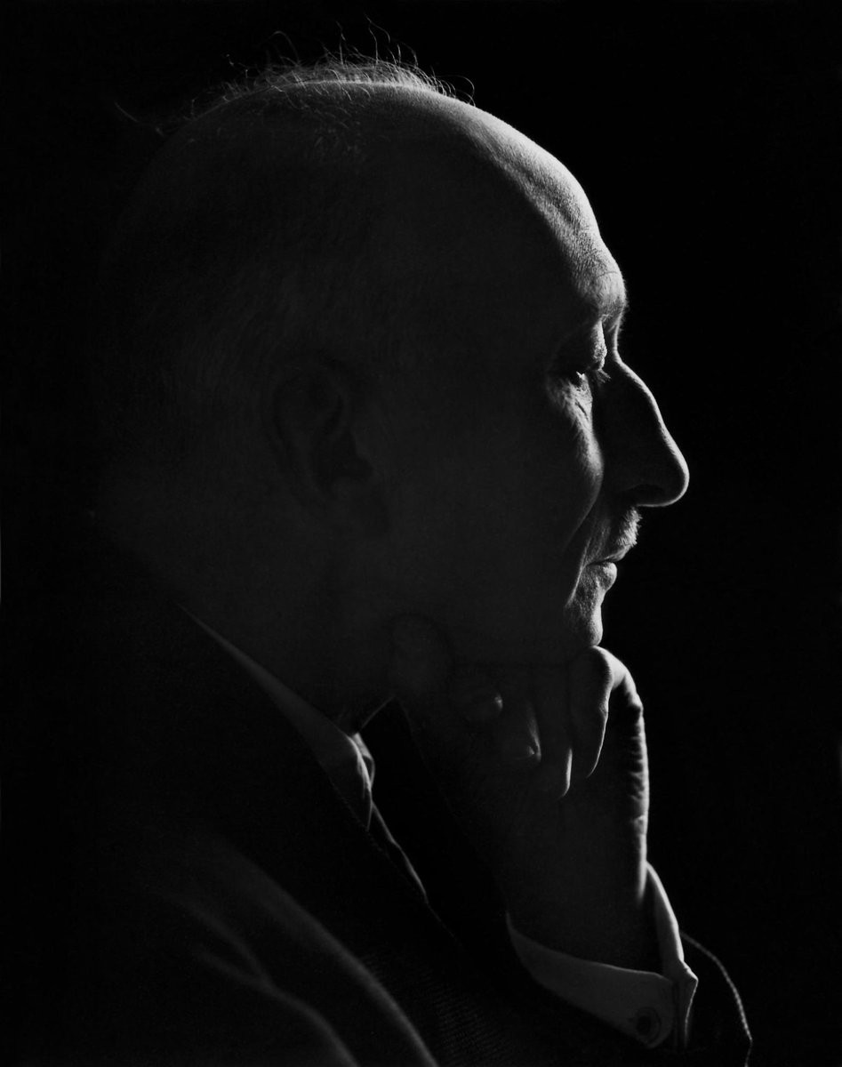 Mauriac, with his hand on his chin, is seen in silhouette.