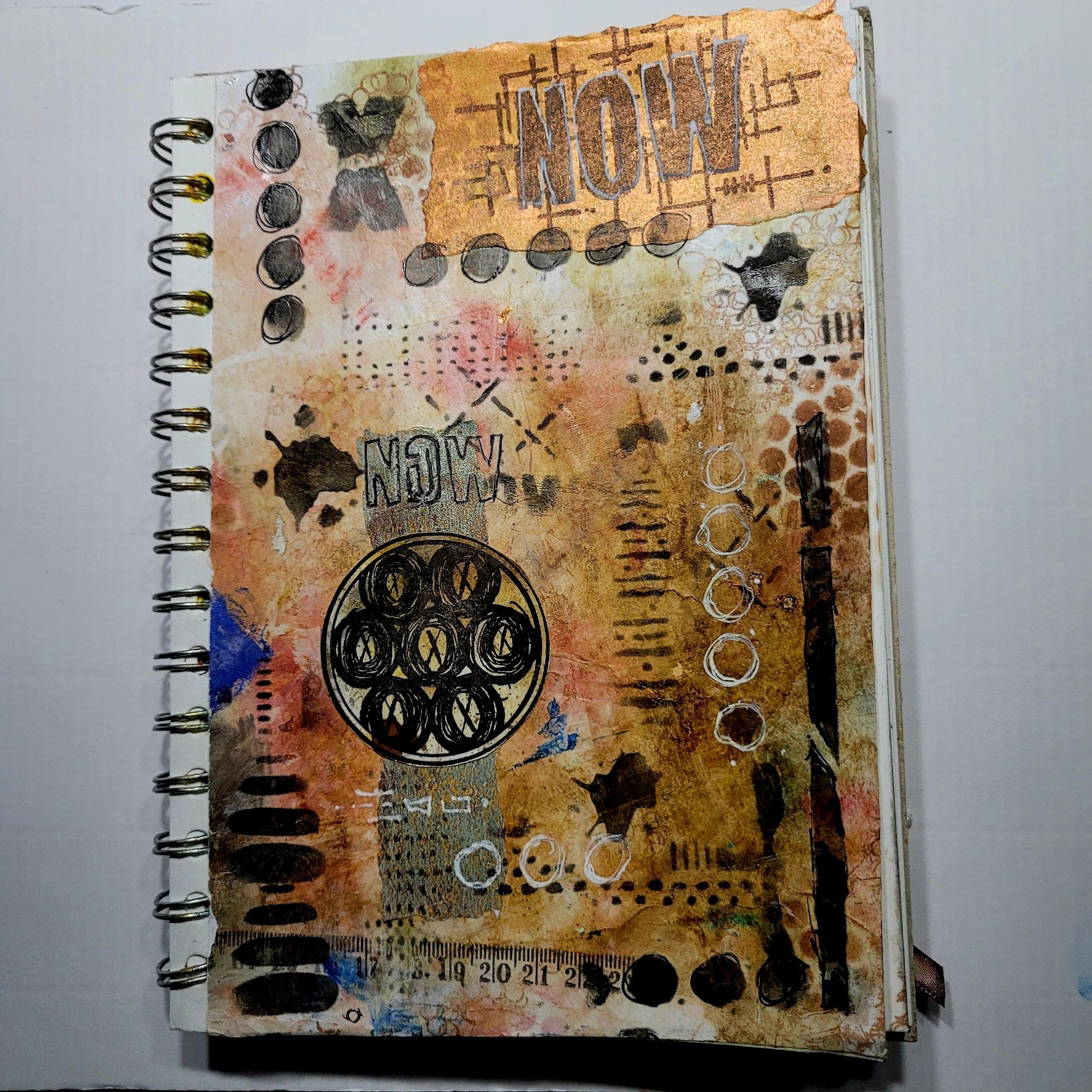 Abstract art journal page using rubber stamps and posca paint markers for mark making.