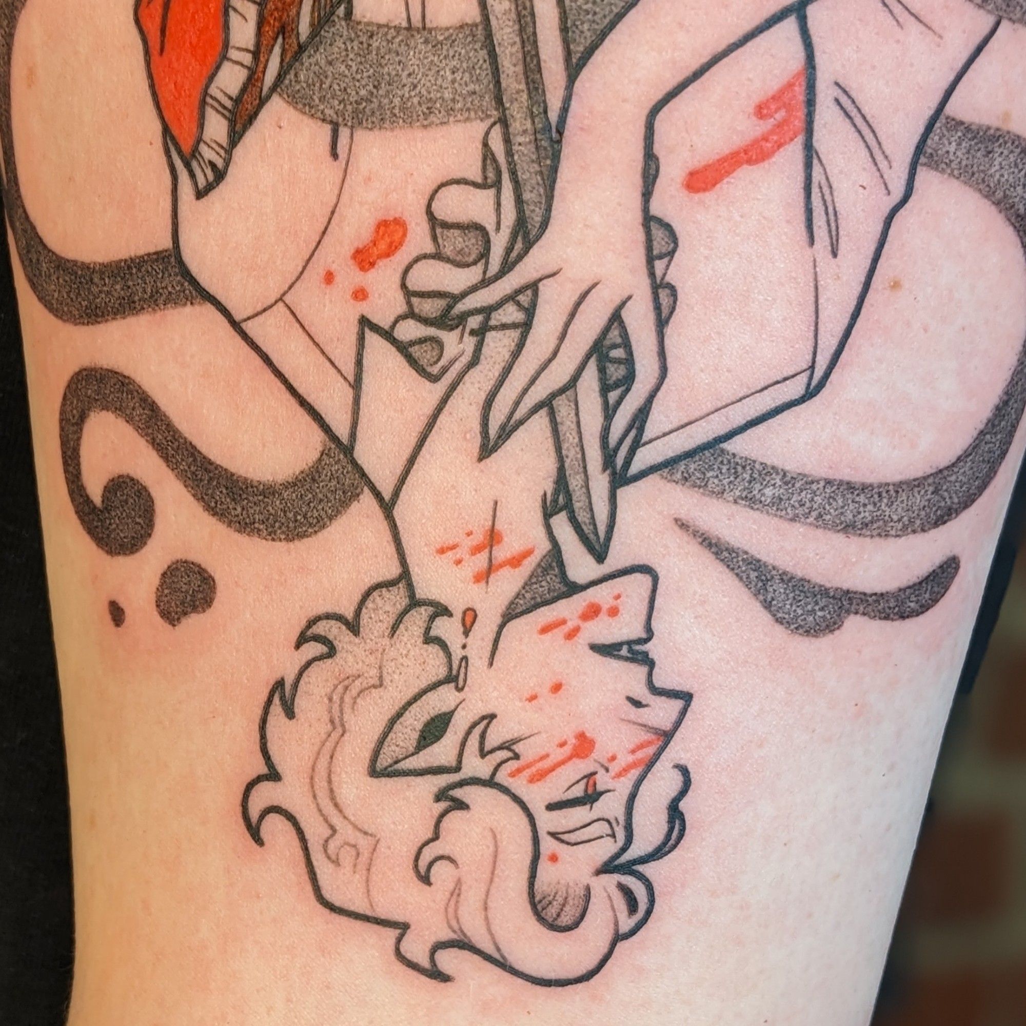 A tattoo of Astarion from Baldur's Gate 3. Spoilers ahead! It is a playing card/rotationally mirrored design that plays with his two plot endings. The top is the ascended Astarion, happy and cruel, in a fancy, embroidered red jacket. The bottom is Astarion denied and covered in blood. Sad but feeling. Ascended Astarion holds the hilt of the sword of life stealing, which points to the throat of the reverse Astarion, whose hand caresses the blade. The second photo is a close up of ascended Astarion, the third photo is a close up of the reverse Astarion.