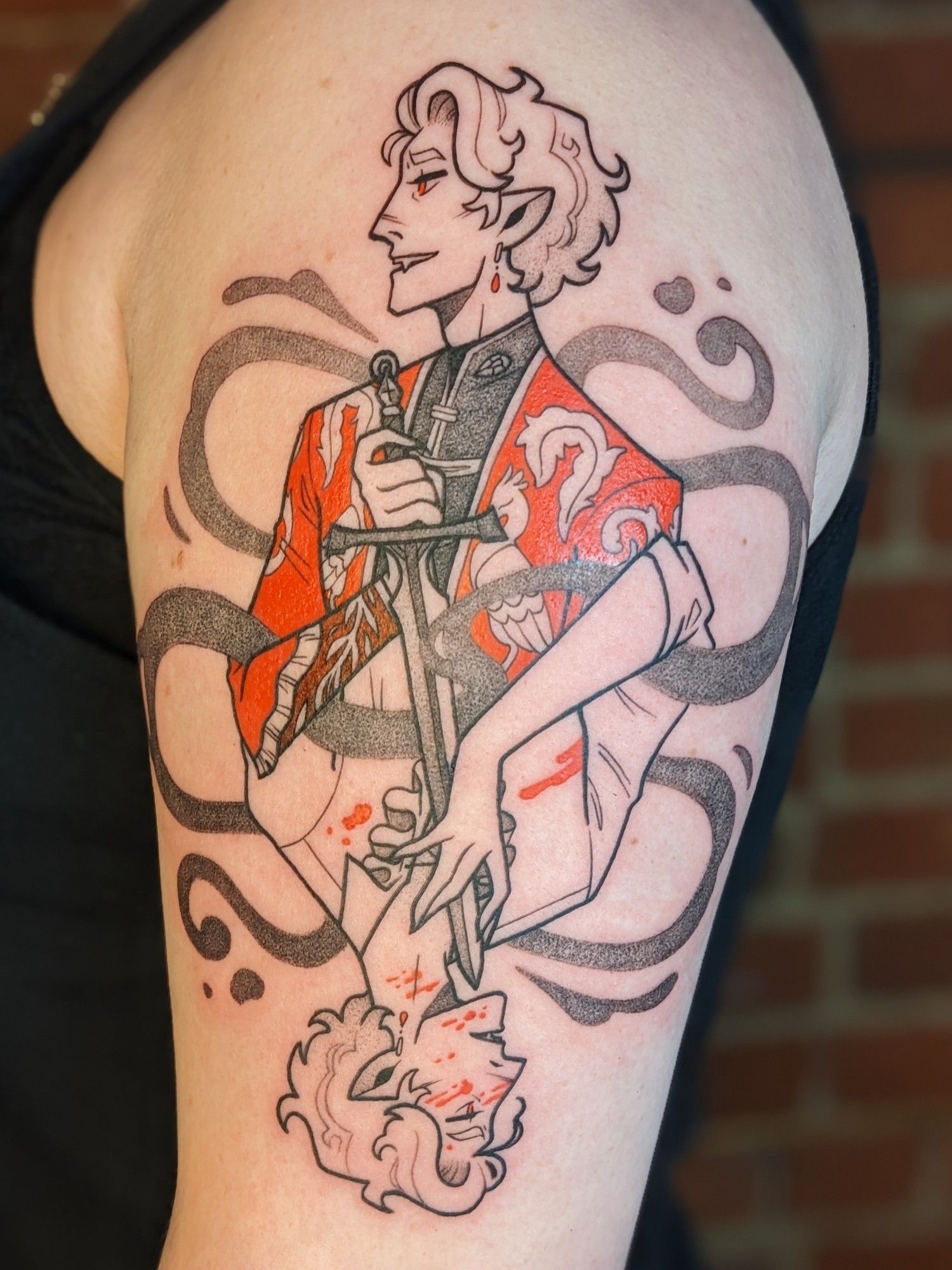 A tattoo of Astarion from Baldur's Gate 3. Spoilers ahead! It is a playing card/rotationally mirrored design that plays with his two plot endings. The top is the ascended Astarion, happy and cruel, in a fancy, embroidered red jacket. The bottom is Astarion denied and covered in blood. Sad but feeling. Ascended Astarion holds the hilt of the sword of life stealing, which points to the throat of the reverse Astarion, whose hand caresses the blade. The second photo is a close up of ascended Astarion, the third photo is a close up of the reverse Astarion.