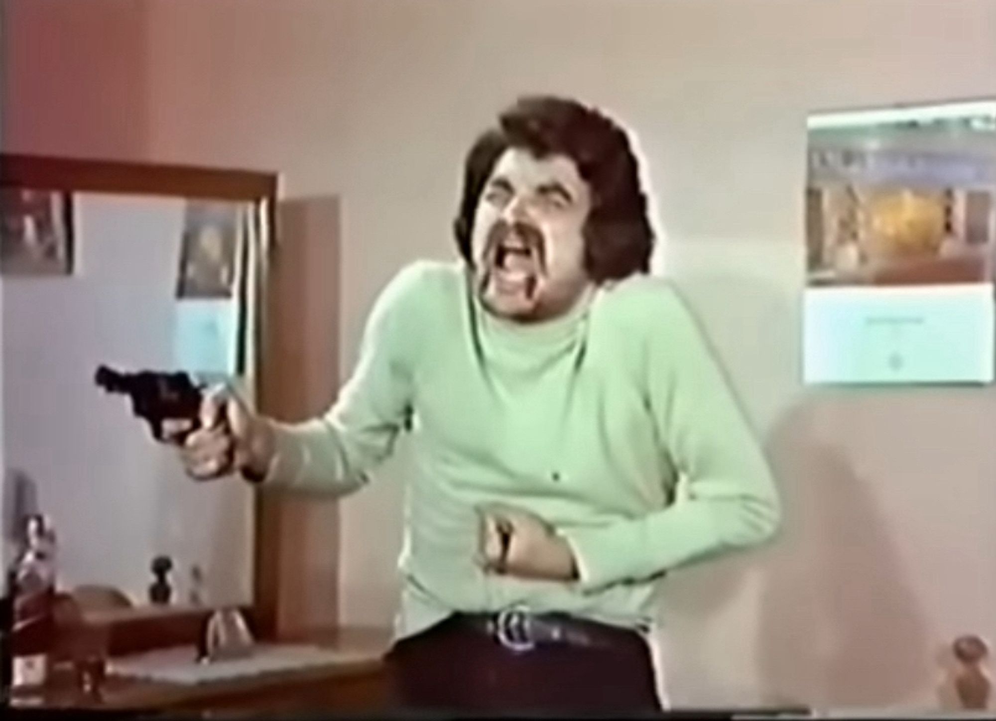 Freeze frame of actor Bülent Kayabas, mid-scream during one of the longest and unintentionally hilarious death scenes ever committed to celluloid.