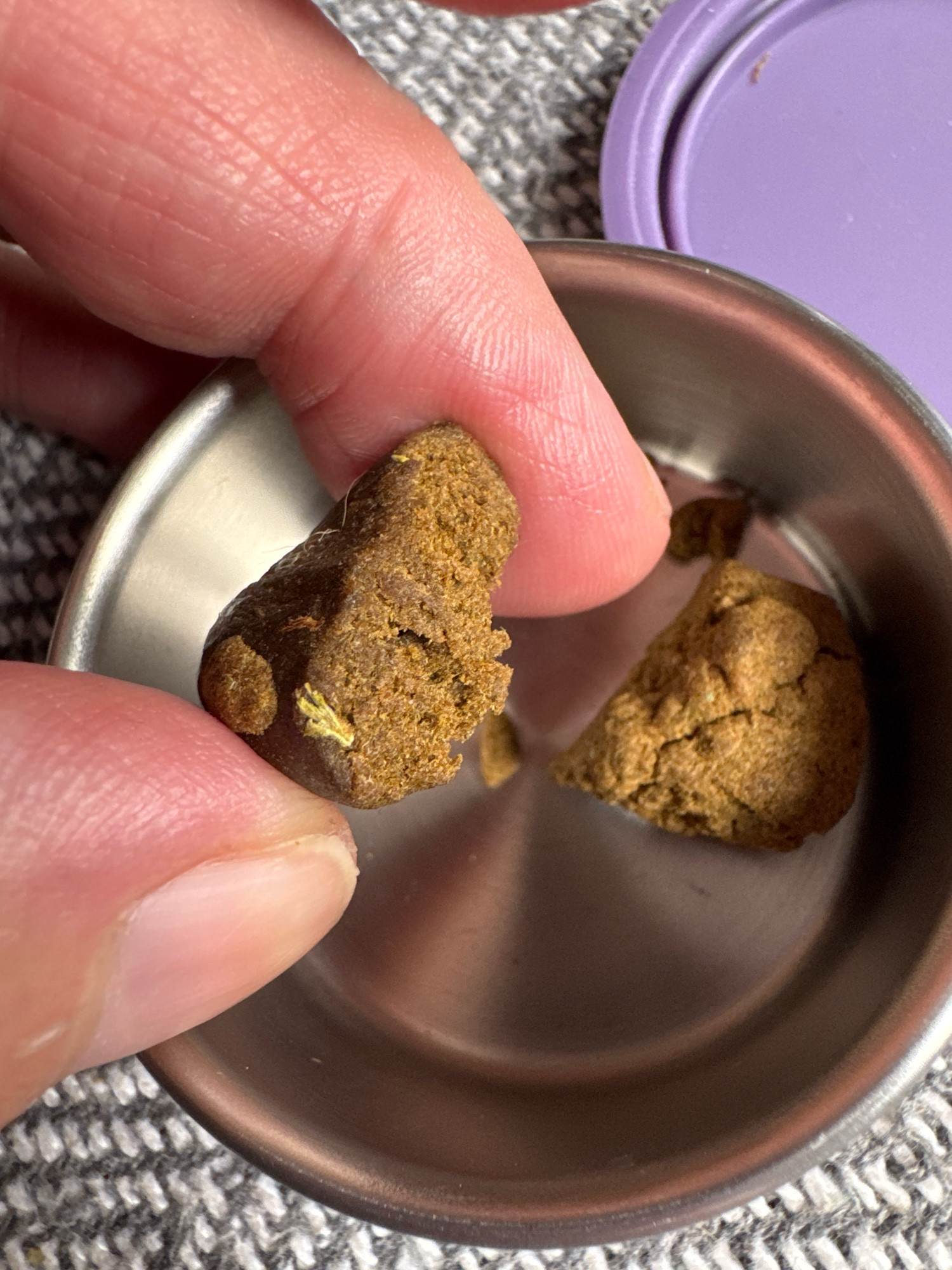 I’m holding a small lump of hash in thumb and forefinger over a sliver pot with another lump and type of hash in. This is old school ‘squidgy black’, it’s dark brown on the outside and mid brown/light yellow inside. This is as good as it gets. but it’s so floral and sedating I love it. The other lump is some silk sieved pollen that’s a bit stronger but more sativa kinda high 