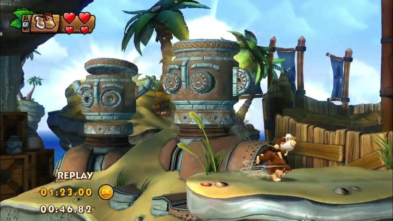 Screenshot of Tropical Freeze level "Sea Stack Attack" showing DK and Cranky Kong rolling past some ancient mechanical titans, forgotten and slumbering as their massive bodies are slowly buried in sand.