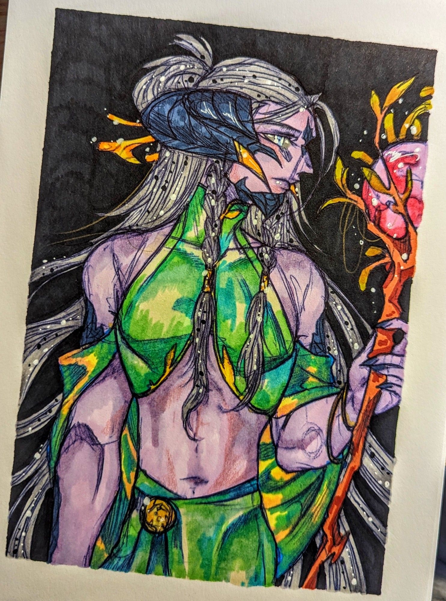 Xaela OC Drak Urgund - Black mage dressed in green clothing holding a branched staff with a red orb glittering at its center.