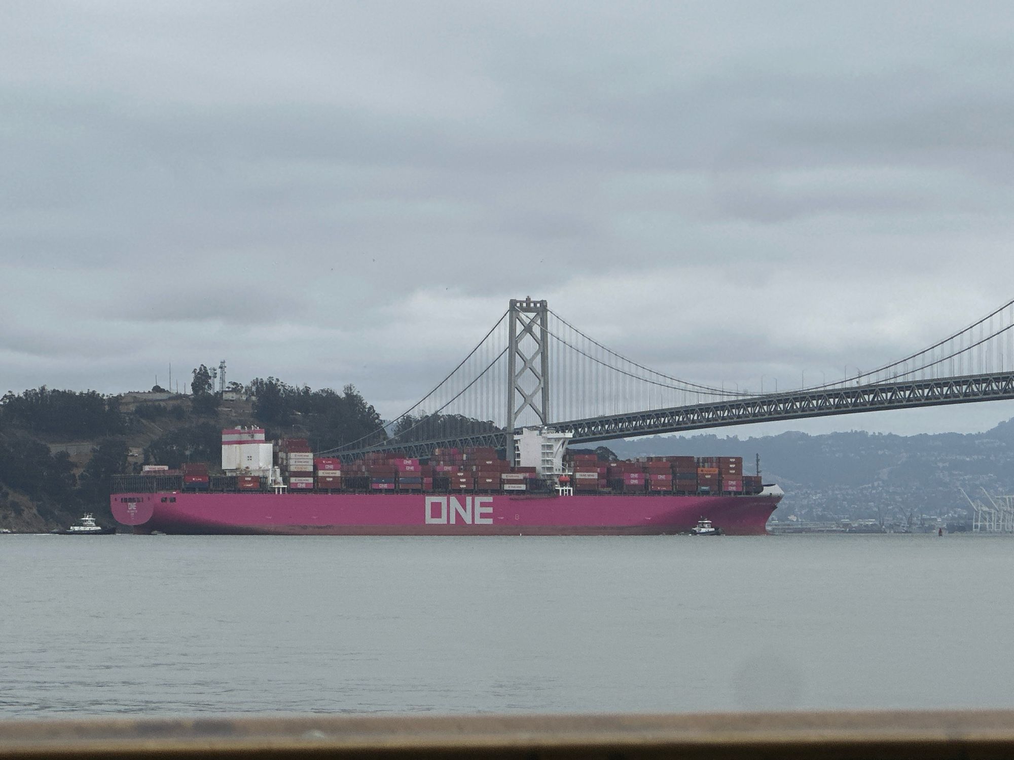 are you shipping container boat with magenta paint all over the side and just the word “one“ across the side going under the Bay bridge in San Francisco