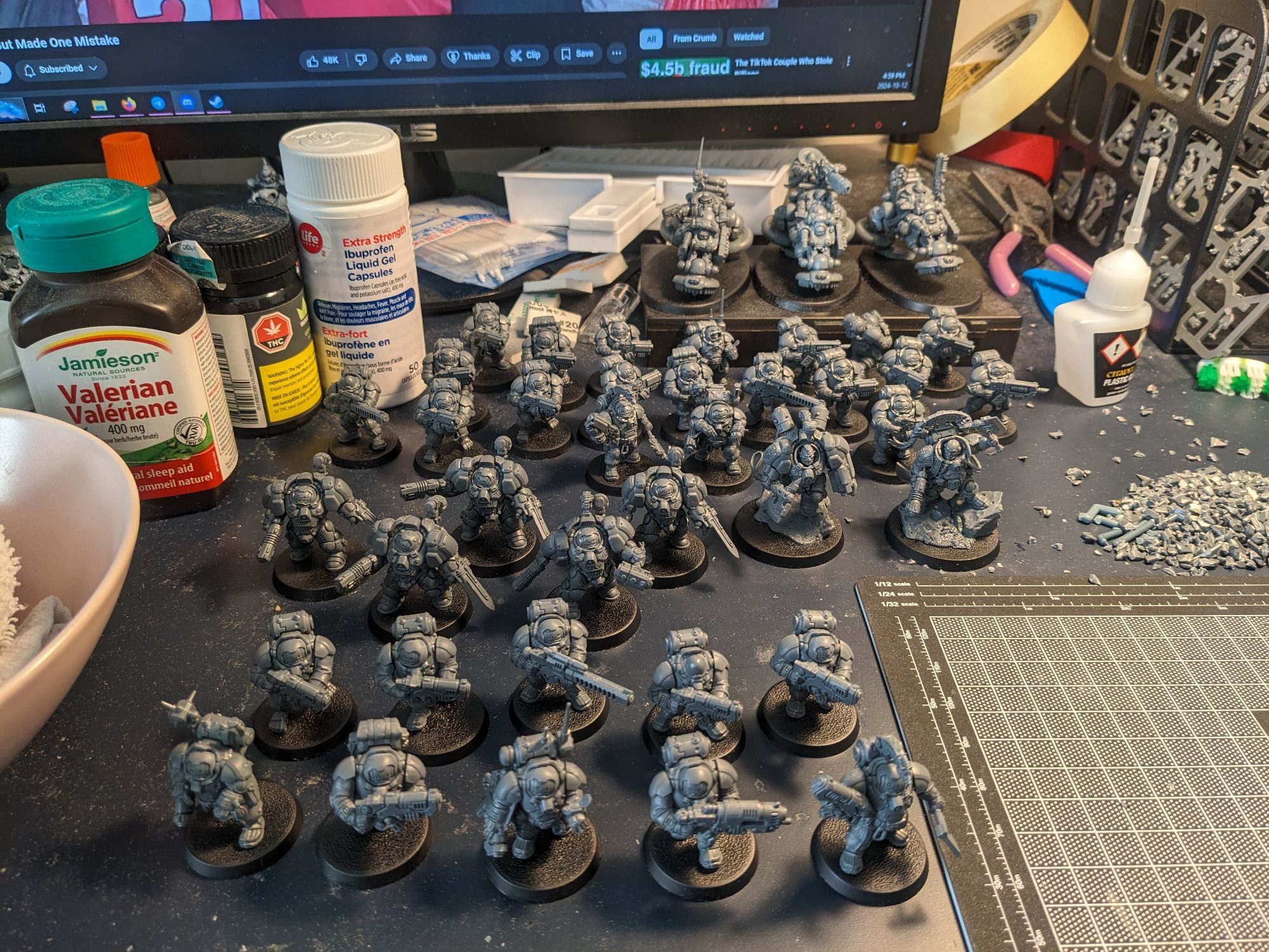 a small army of unpainted Warhammer 40k Votann models