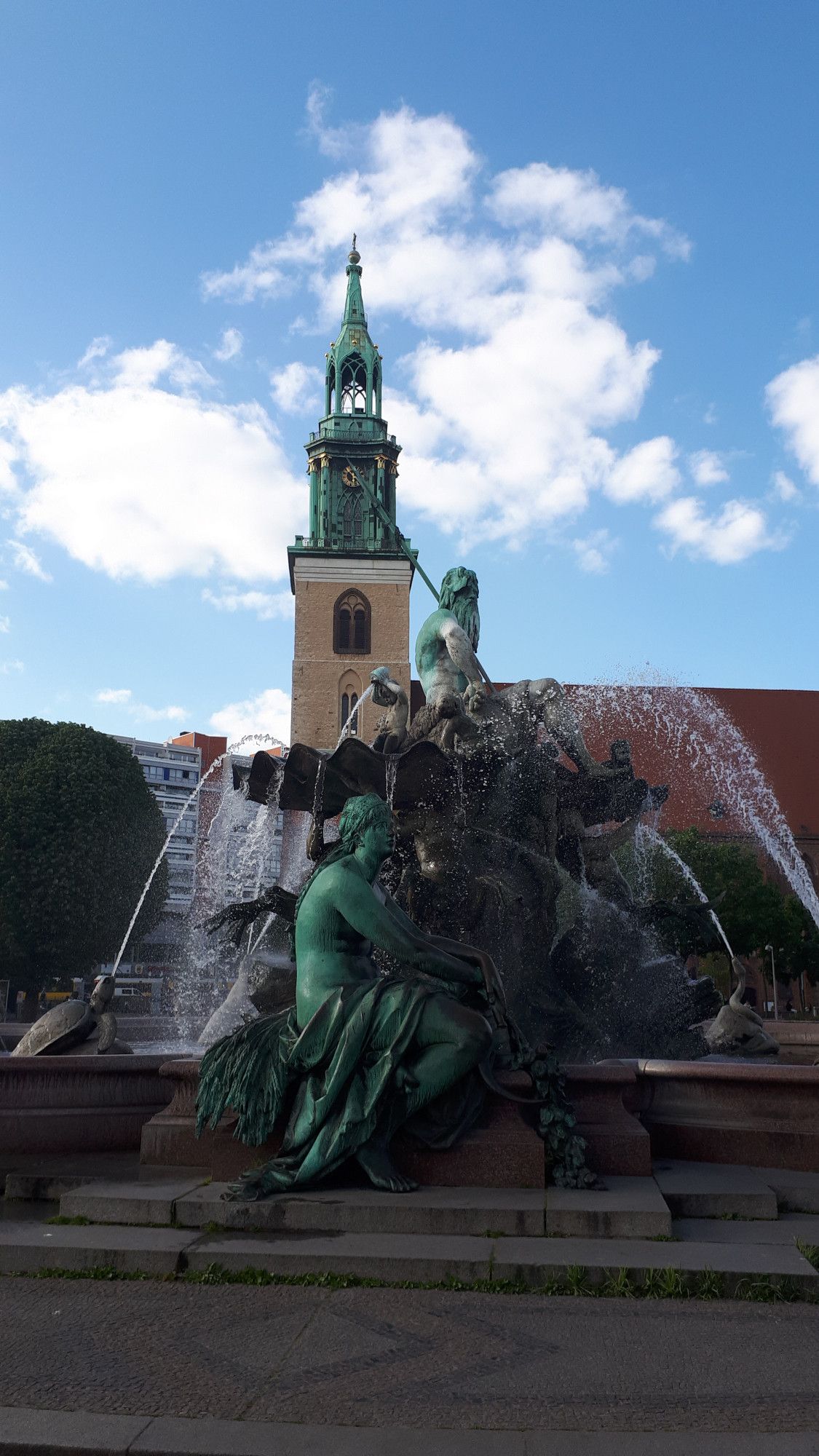 Neptune Fountain Berlin with church