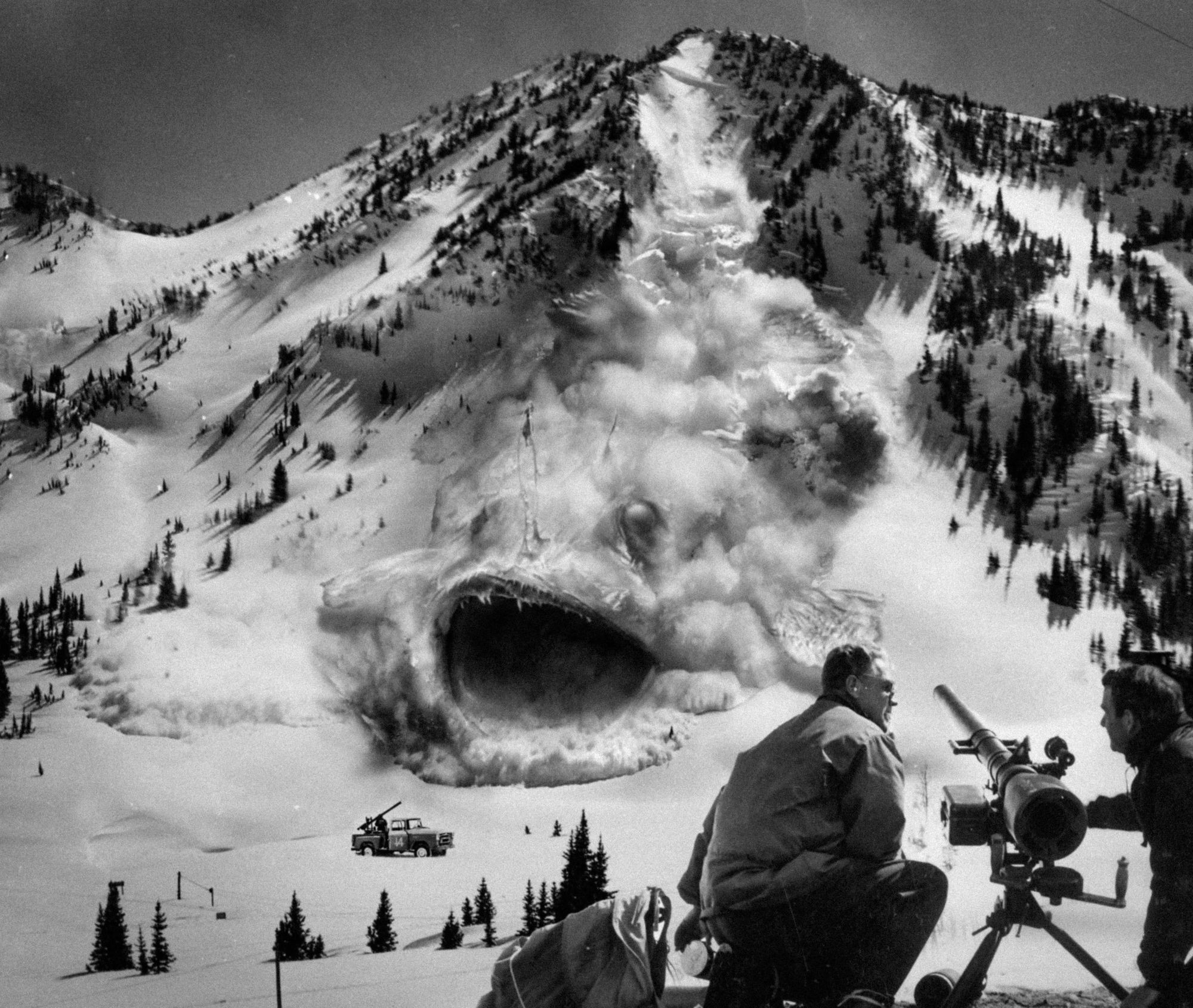 A black and white photo. NPS personnel appear to be using a recoilless rifle to attack a massive creature barrelling down the side of a snowy mountain like an avalanche. A second recoilless rifle, mounted on a car, is about to be devoured by its gaping maw.