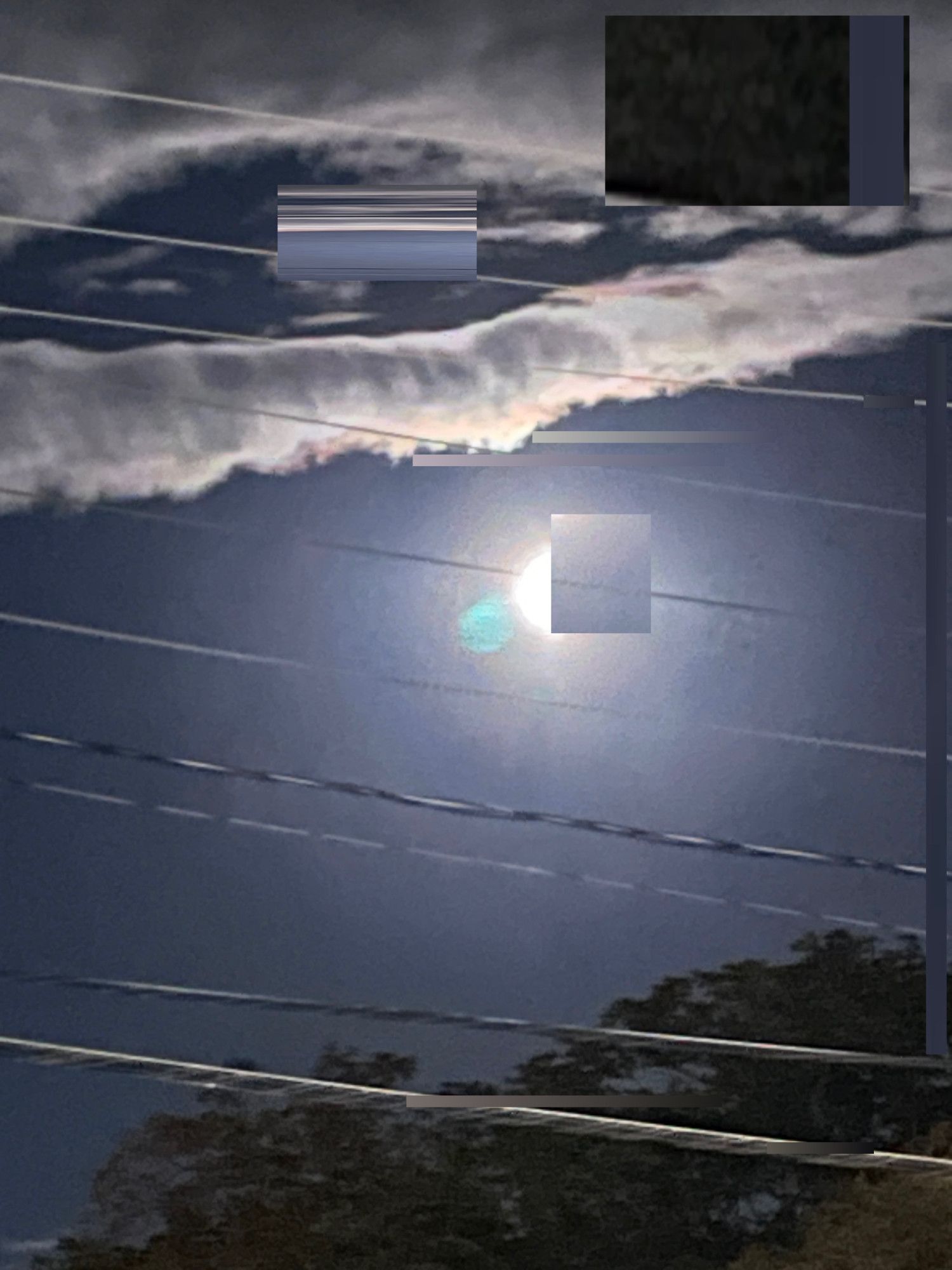 A digitally manipulated dodgy image of a full moon, some power and telecom lines and a few clouds…