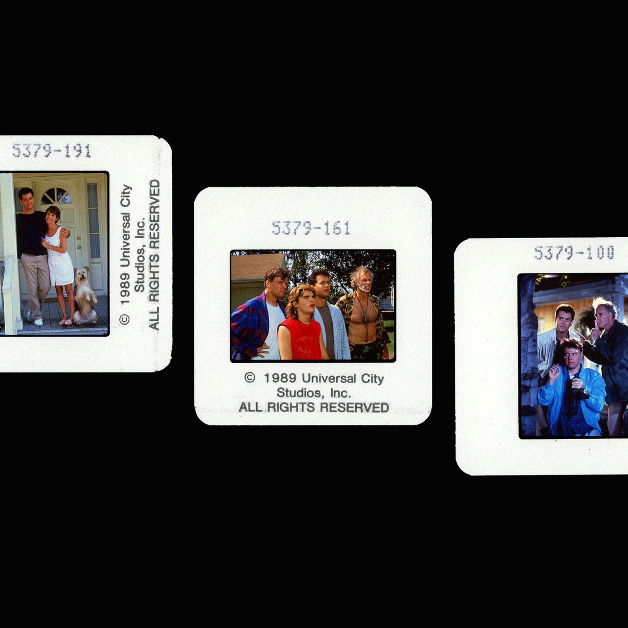 Publicity slides from THE 'BURBS. Left: Tom Hanks and Carrie Fisher in front of house front door with dog. Middle: Rick Ducommun, Corey Feldman, Hanks, and Bruce Dern staring off-camera confusion. Right: Hanks, Dern, and Ducommun spying from behind a tree.