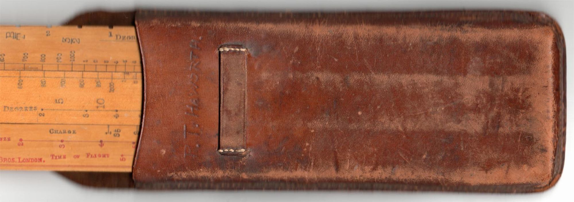 Burton's 4.5" Howitzer slide rule in leather case.