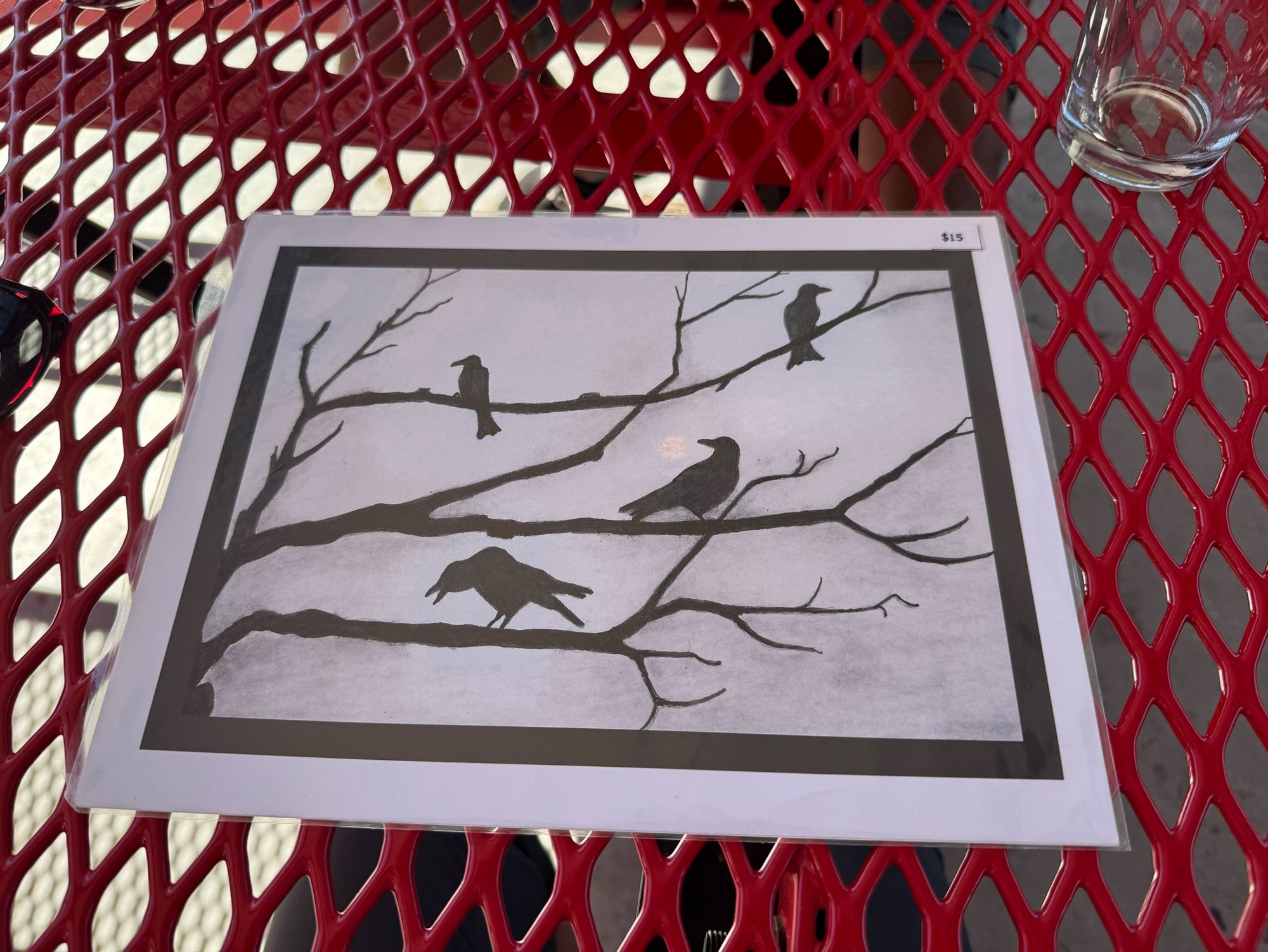 Charcoal drawing of crows in a tree