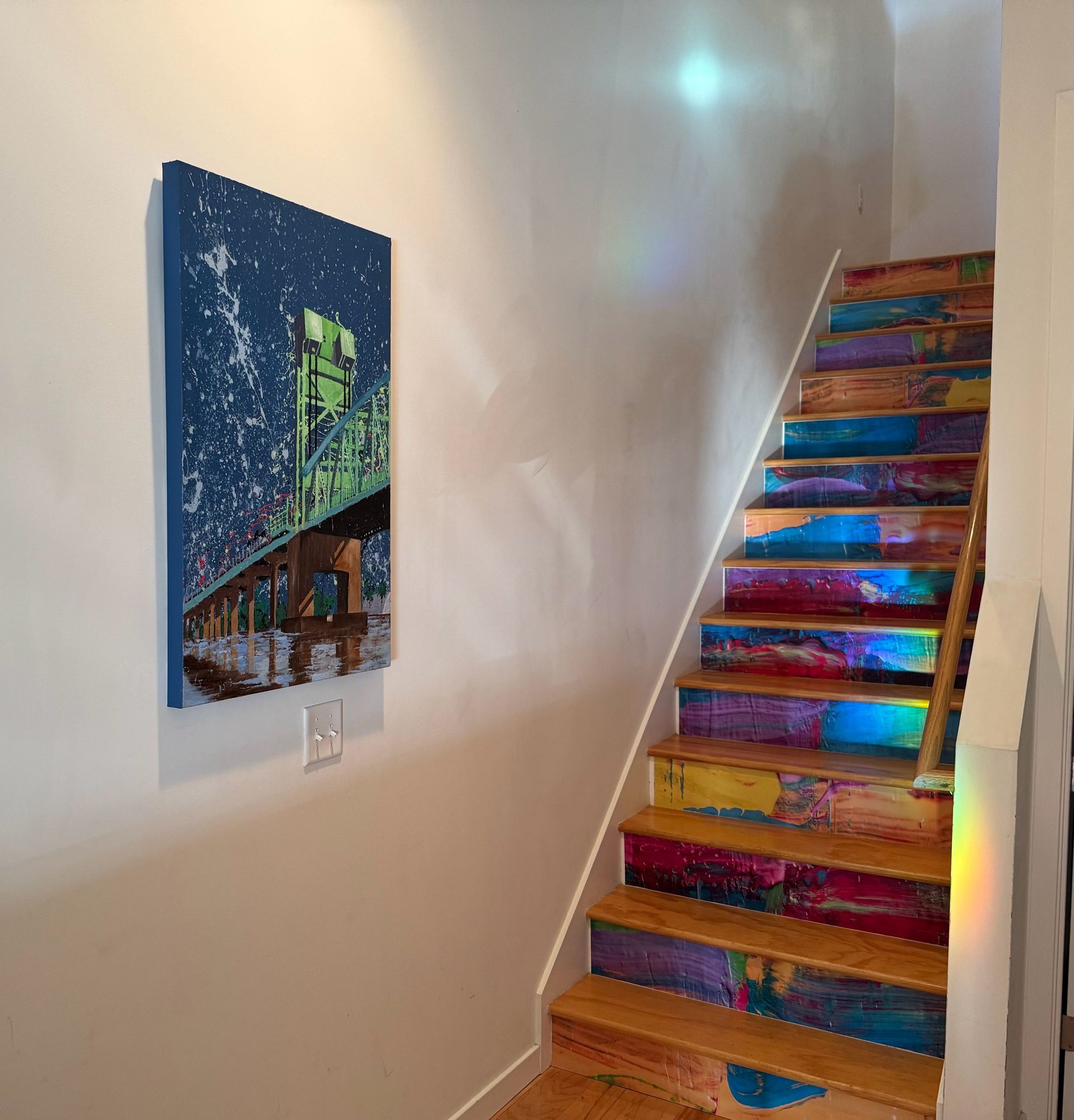 Painting of the Cape Fear Memorial Bridge hung in the stairwell landing