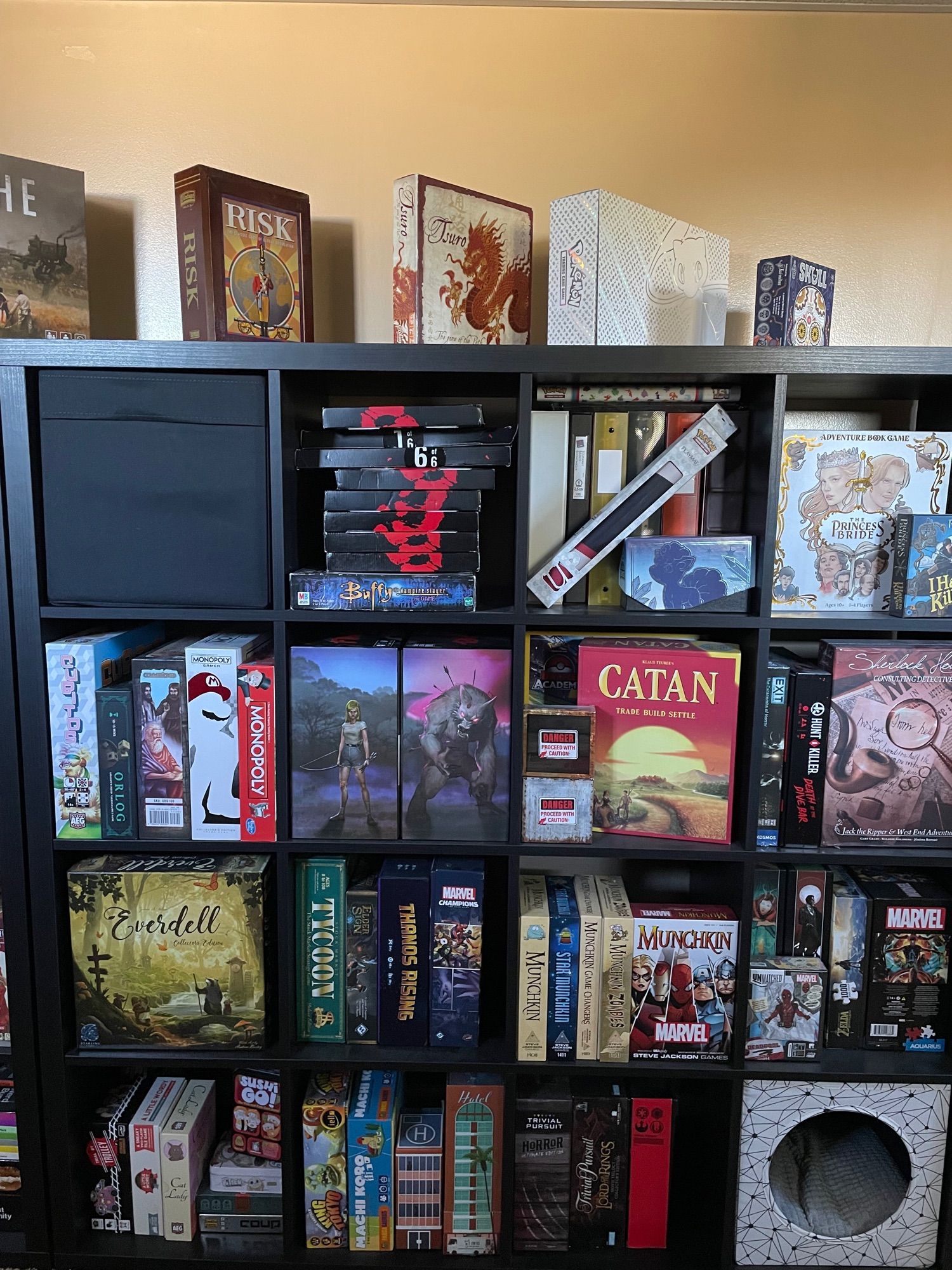 a pic of my board game collection. including Catan, Everdell Collector’s Edition, Princess Bride, Skull, Tsuro, some Pokémon cards, a special edition of Risk, Burgle Bros, Cat Lady, Final Girl Seasons 1 and 2, Munchkin and many more