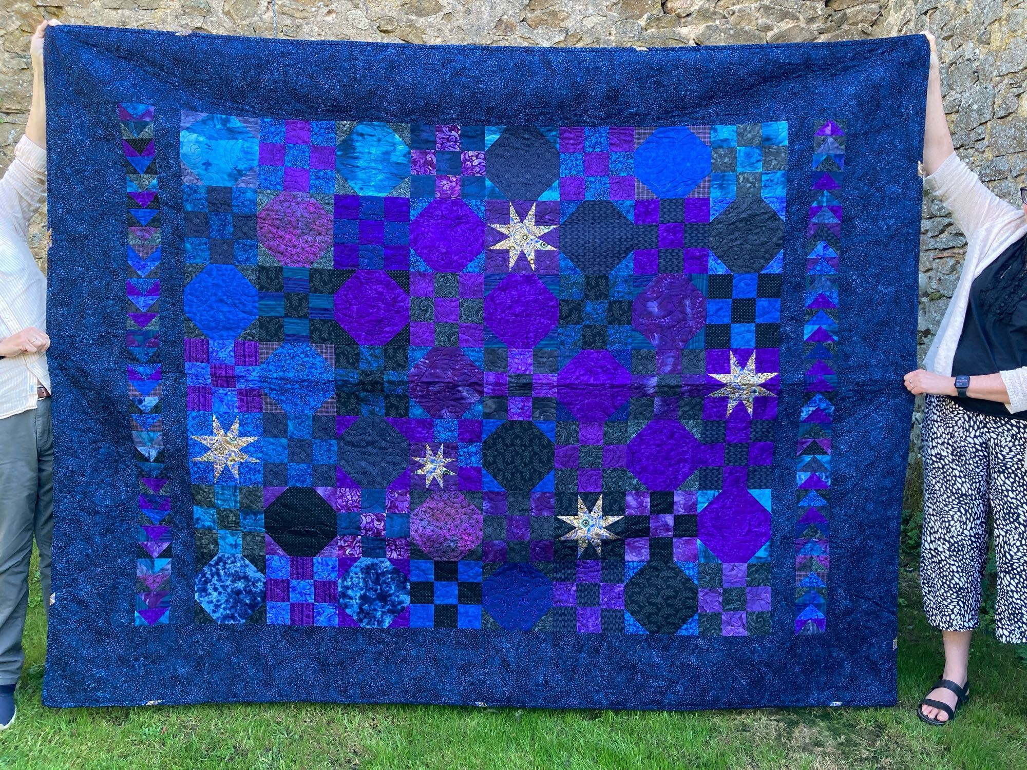 Blue and purple quilt with stars