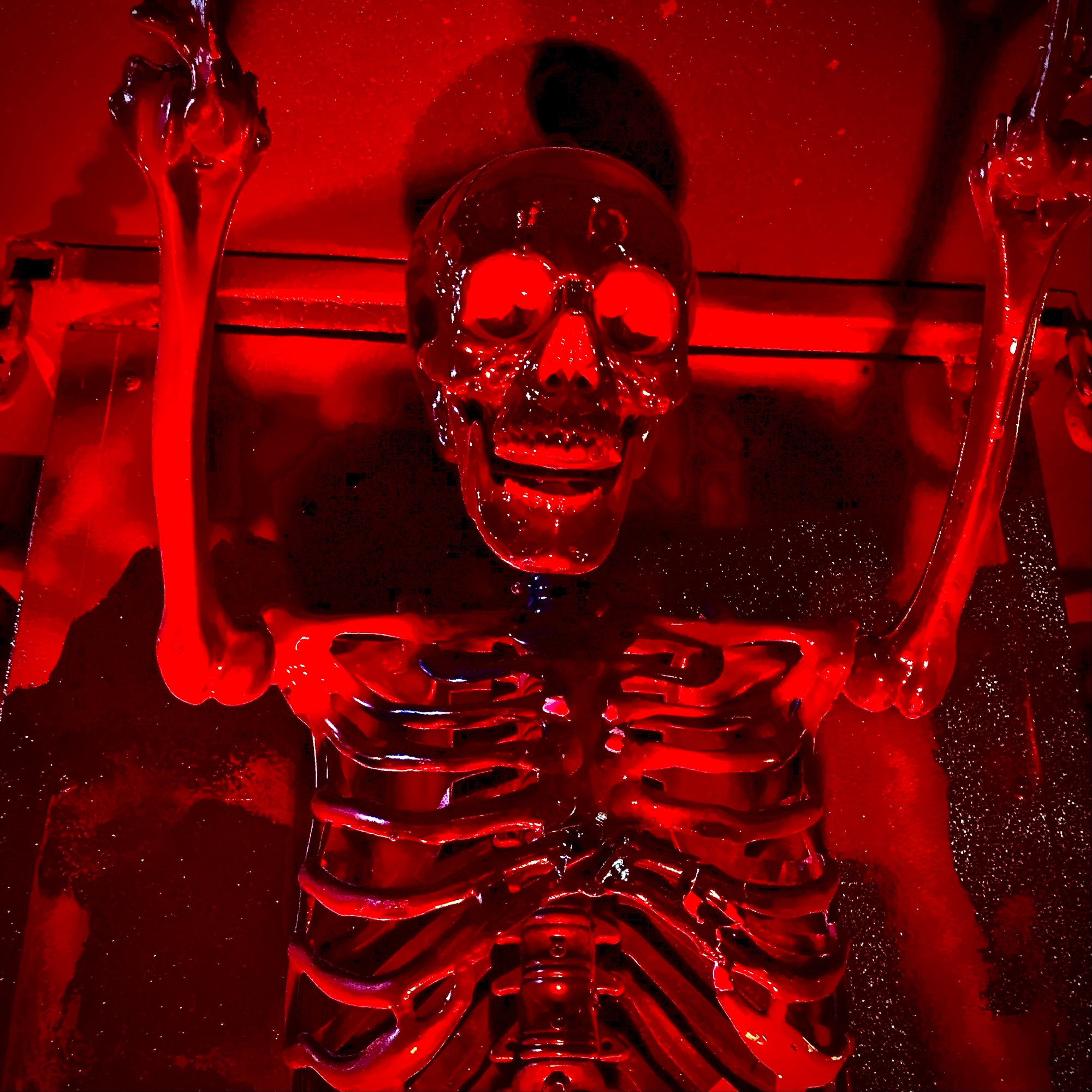 A skeleton in red light.