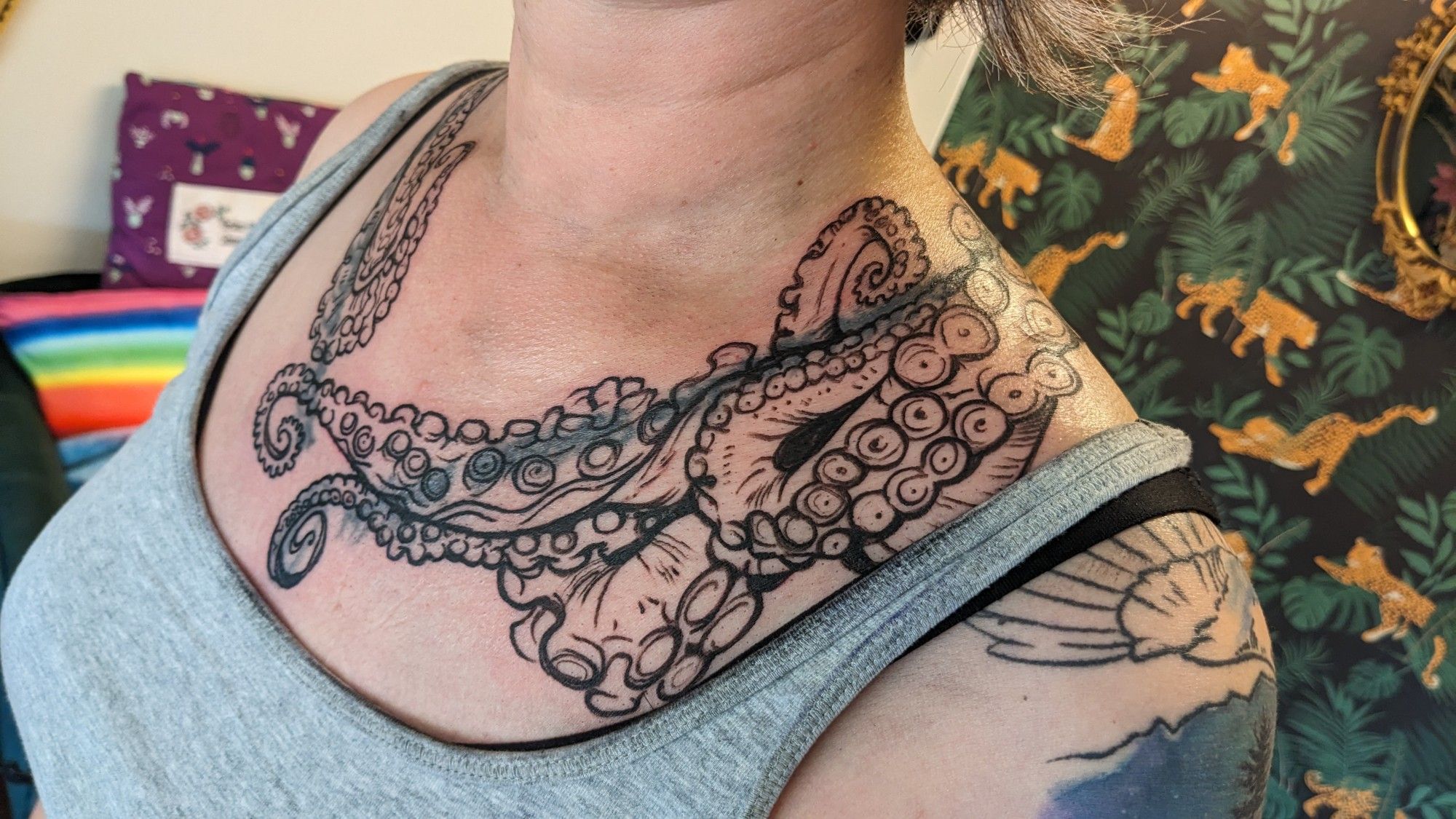 tentacles tattooed around my neck and on my chest area covering up an old tattoo