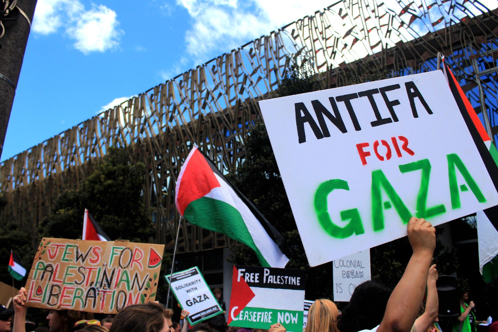 Pōneke Anti-Fascist Coalition and supporters rally for Gaza outside the New Zealand Supreme Court in Wellington, in defiance of Zionist, Islamophobic  hatemongers like Brian Tamaki and Destiny Church, with signs that say: Jews for Palestinian Liberation; Free Palestine, Ceasefire Now; and Antifa for Gaza.