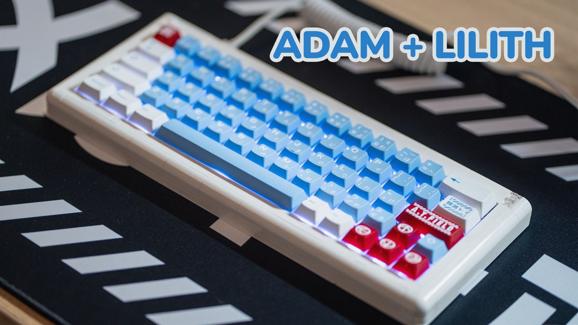 YouTube thumbnail featuring a white mechanical keyboard built from Lego bricks, on a black deskmat with Japanese text and kind of a cyber vibe. the keycaps are light blue, white and red, like Rei Ayanami's color scheme. the legend for the enter key says 'A.T. Field'
Text on the thumbnail: Adam + Lilith