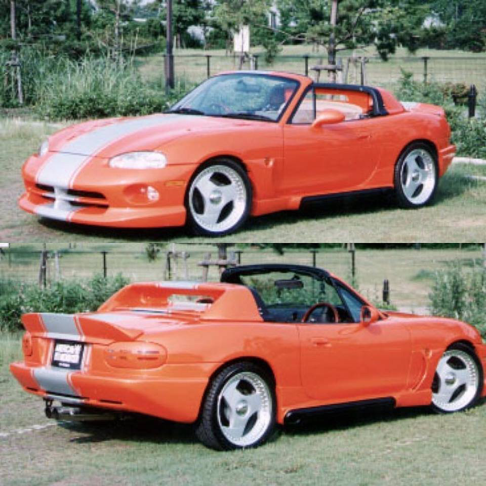 Red Dodge viper style body kit on a mazda miata