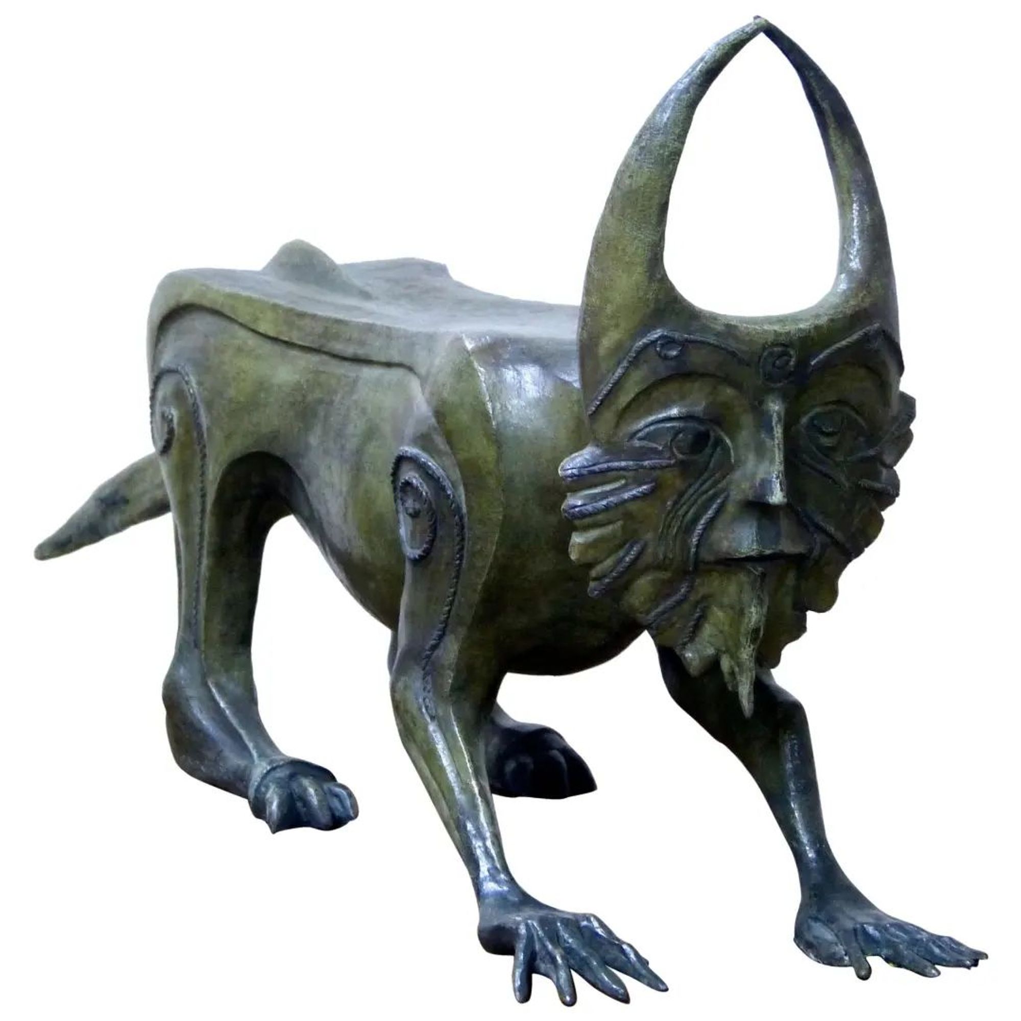 Sculpture in green tinted bronze of a stylized quadruped with cat-like hind legs, human arms in front and a human face ringed with leaf-like forms and two inward-curving horns on top.