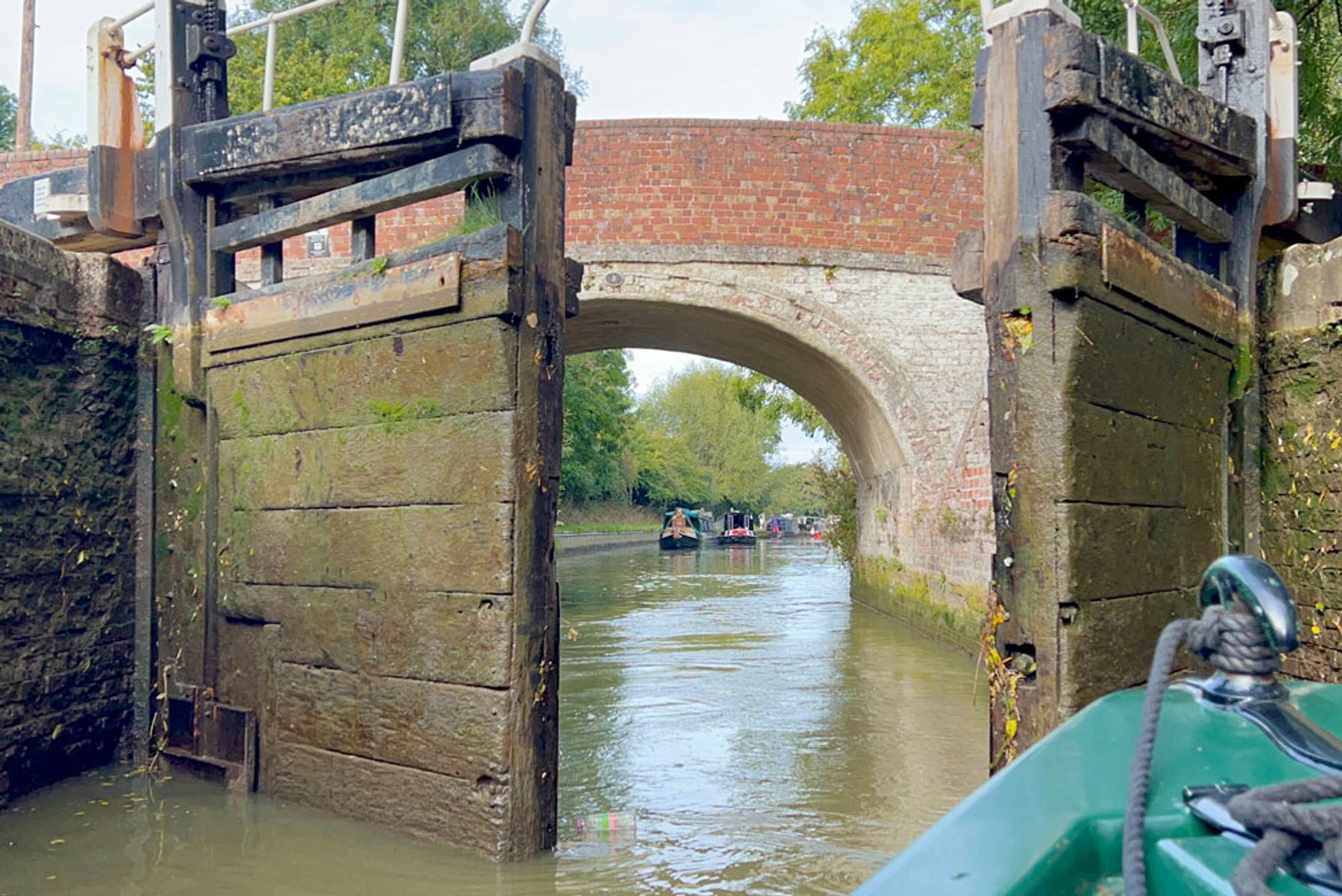 Lock and narrowboats, England.