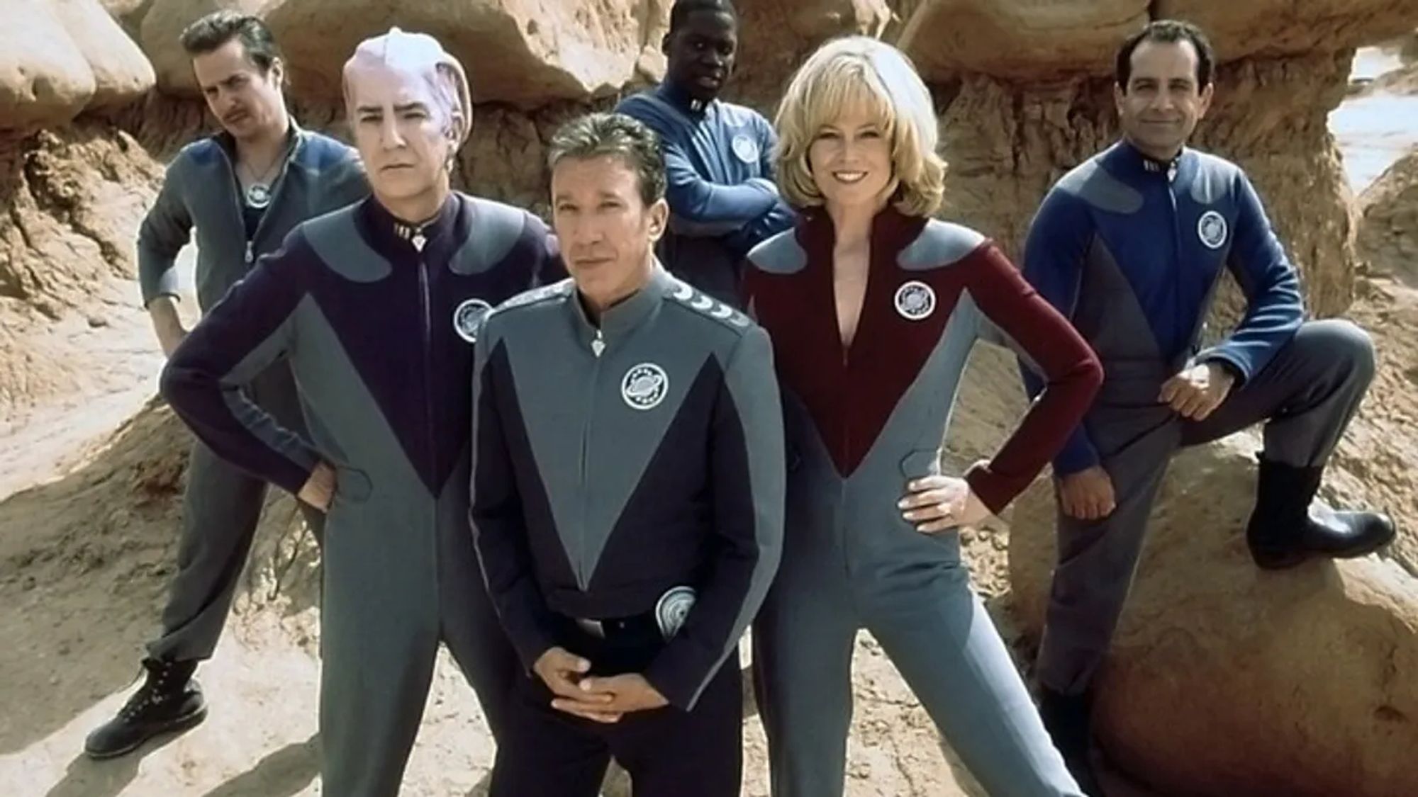 Sam Rockwell, Alan Rickman, Tim Allen, Daryl Mitchell, Sigourney Weaver, and Tony Shalhoub as the cast appearing in a promotional photo for "Galaxy Quest" (1999)