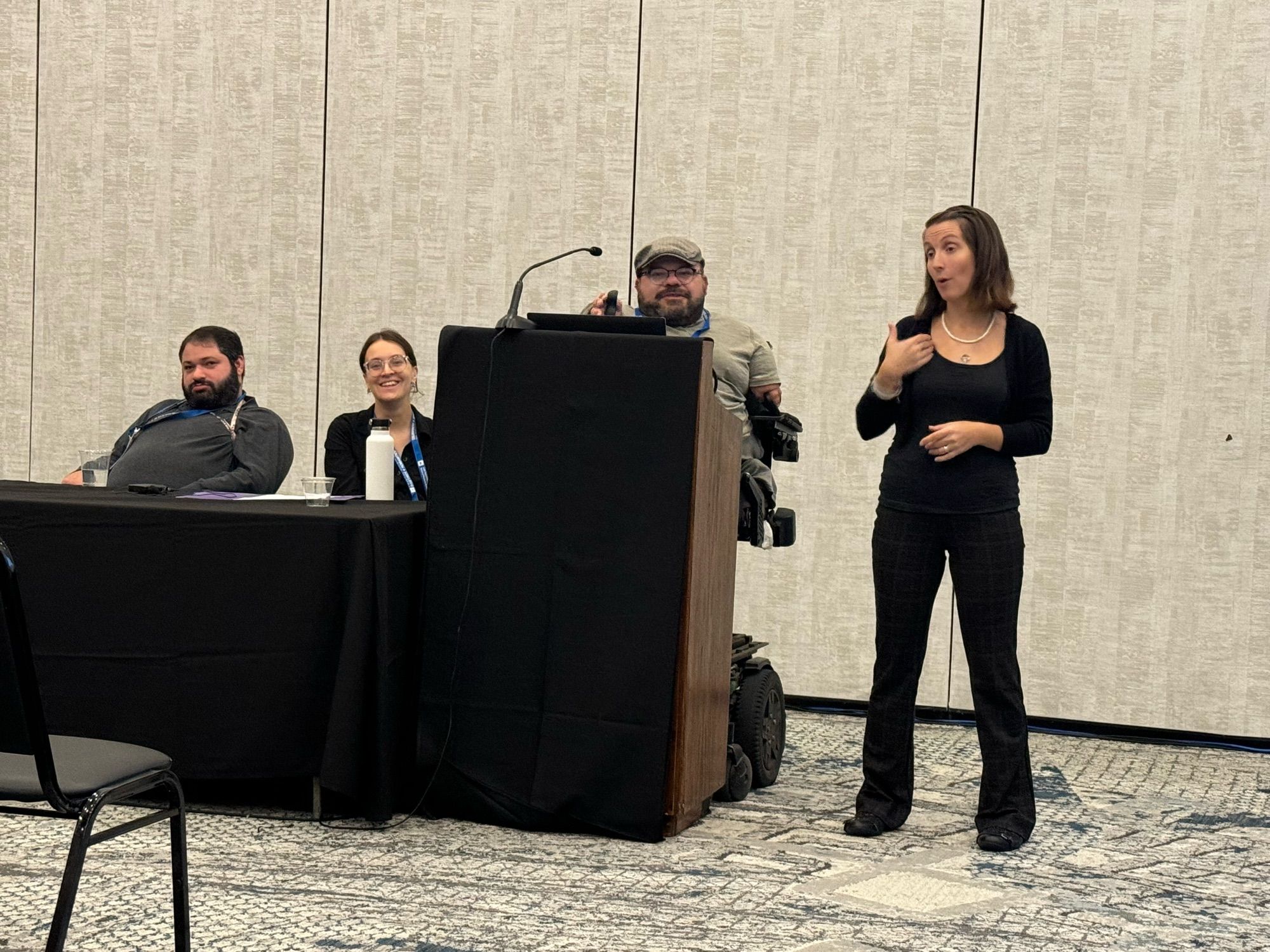 Panelists at ASBH, left to right: Kevin T. Mintz, Jaime Konerman-Sease, Joe Stramondo, and an interpreter. (Liz Bowen is off-screen.)