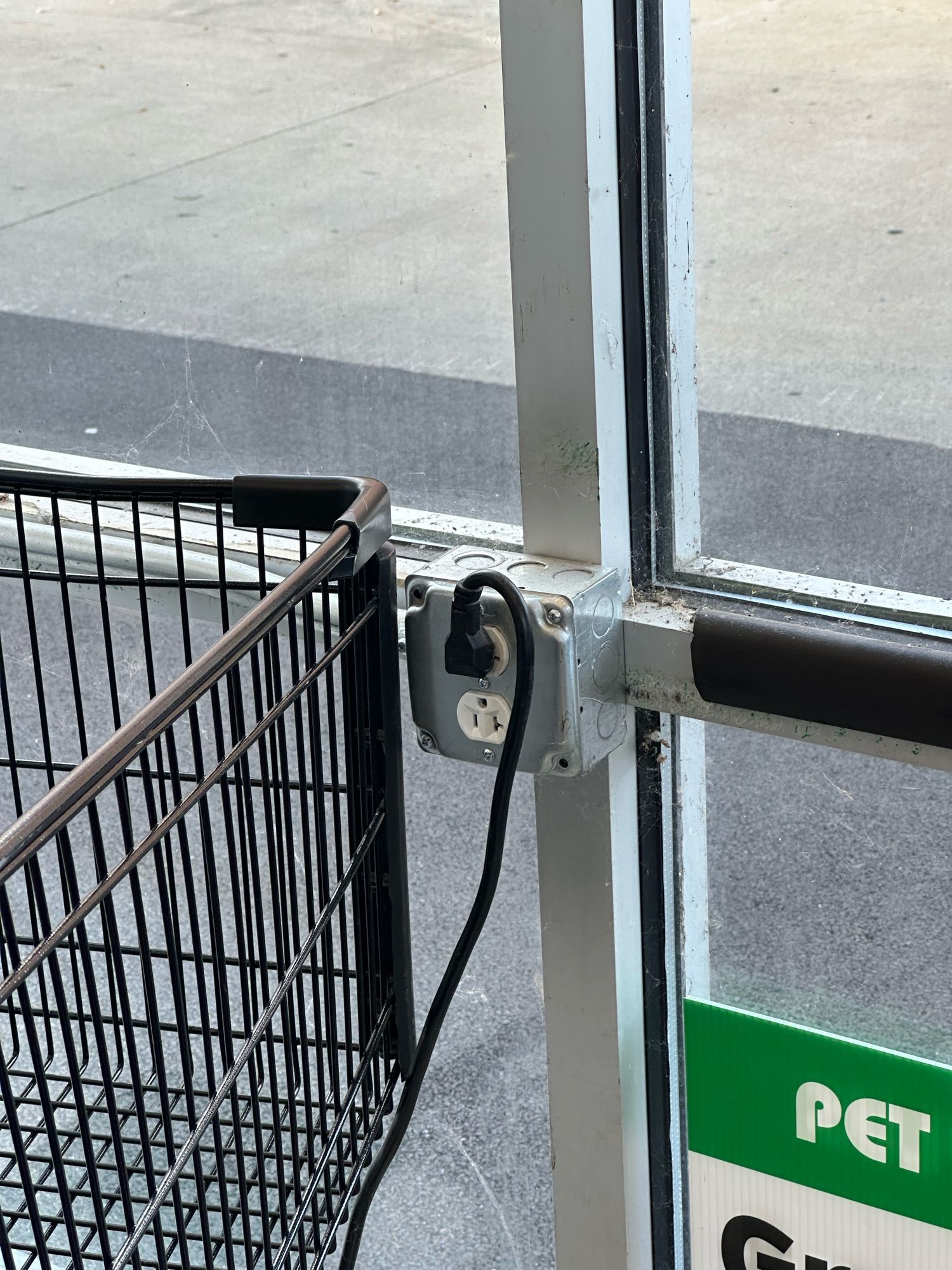 Shopping carts staging bump-stop is an electrical outlet