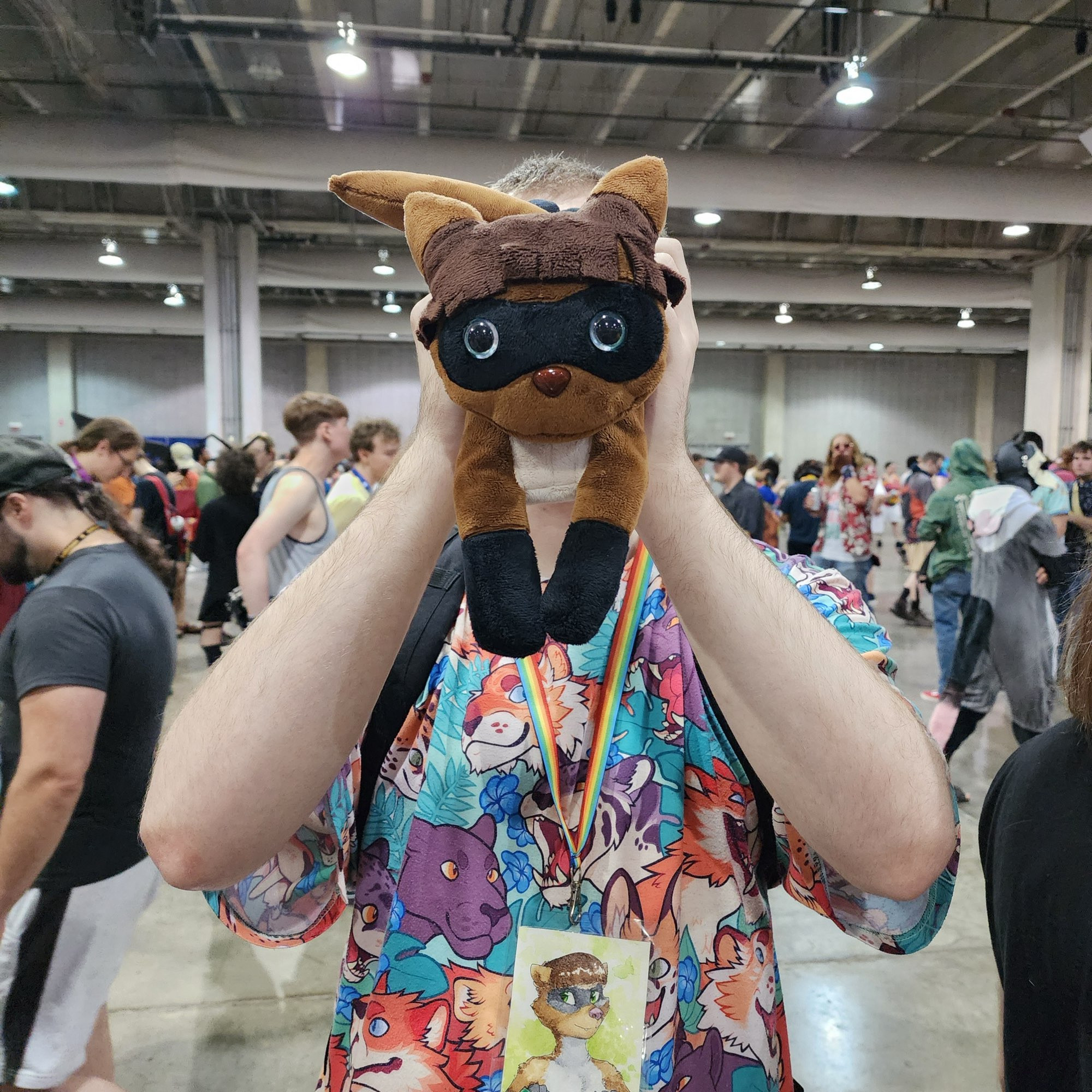 Human Mello has his face obstructed by Plush Ferret Mello. Both creatures are patiently standing in the registration line.