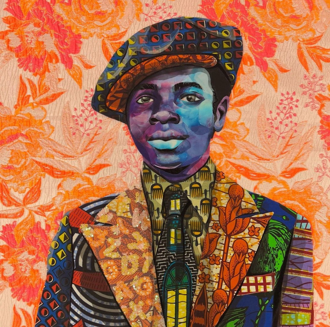 A quilt portrait of a young man in a jaunty jacket, shirt, and tie. His Black skin is depicted in blues and purples, his clothes are a loud riot of oranges, yellows, blues, and greens. He’s got a jaunty newsboy cap worn at a lil’ tilt. He is set against an orange and cream floral background fabric