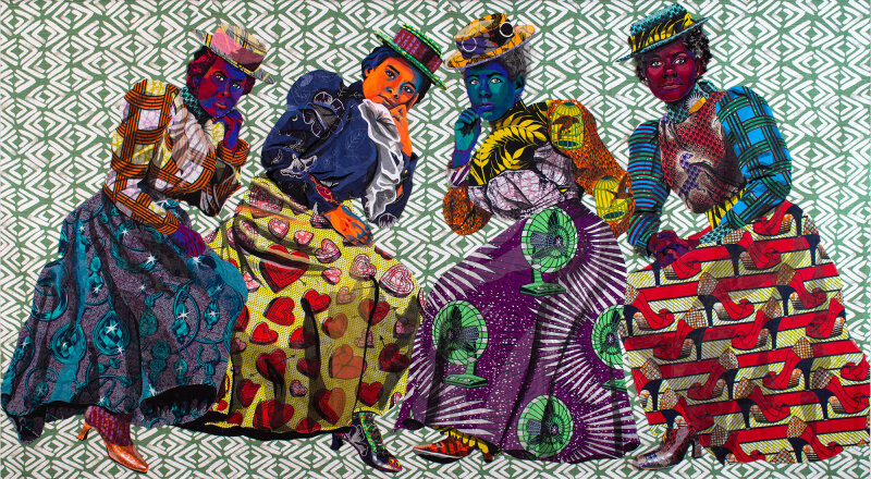 A quilt with a group of four Black women seated with their chins resting on their hands. They’re wearing  colorful Edwardian fashions and are set against a green and white geometric pattern background fabric