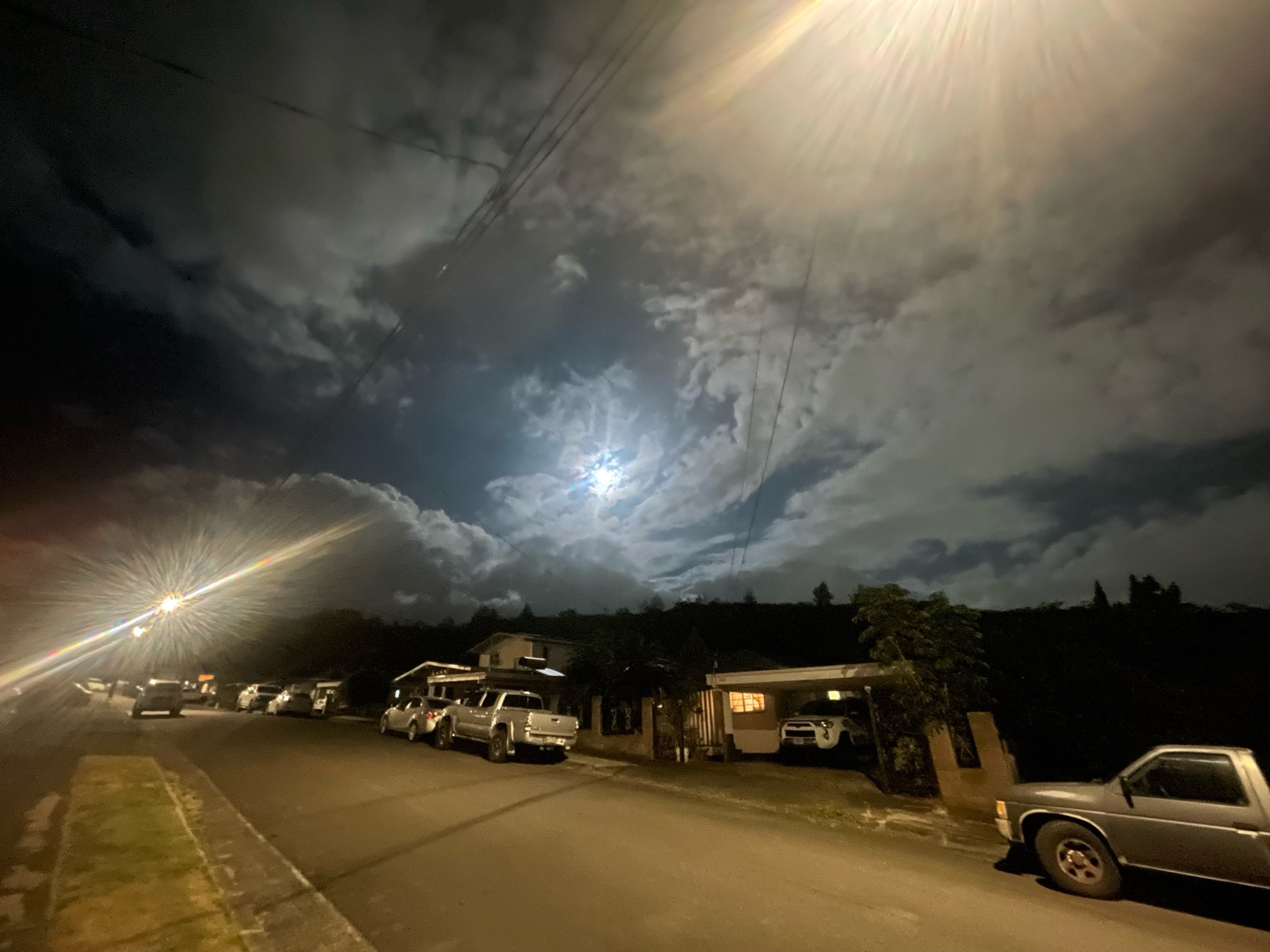 Same picture as before, but a wider frame that enhances the slight spiral effect of the clouds around the moon and pushes it back a little further 