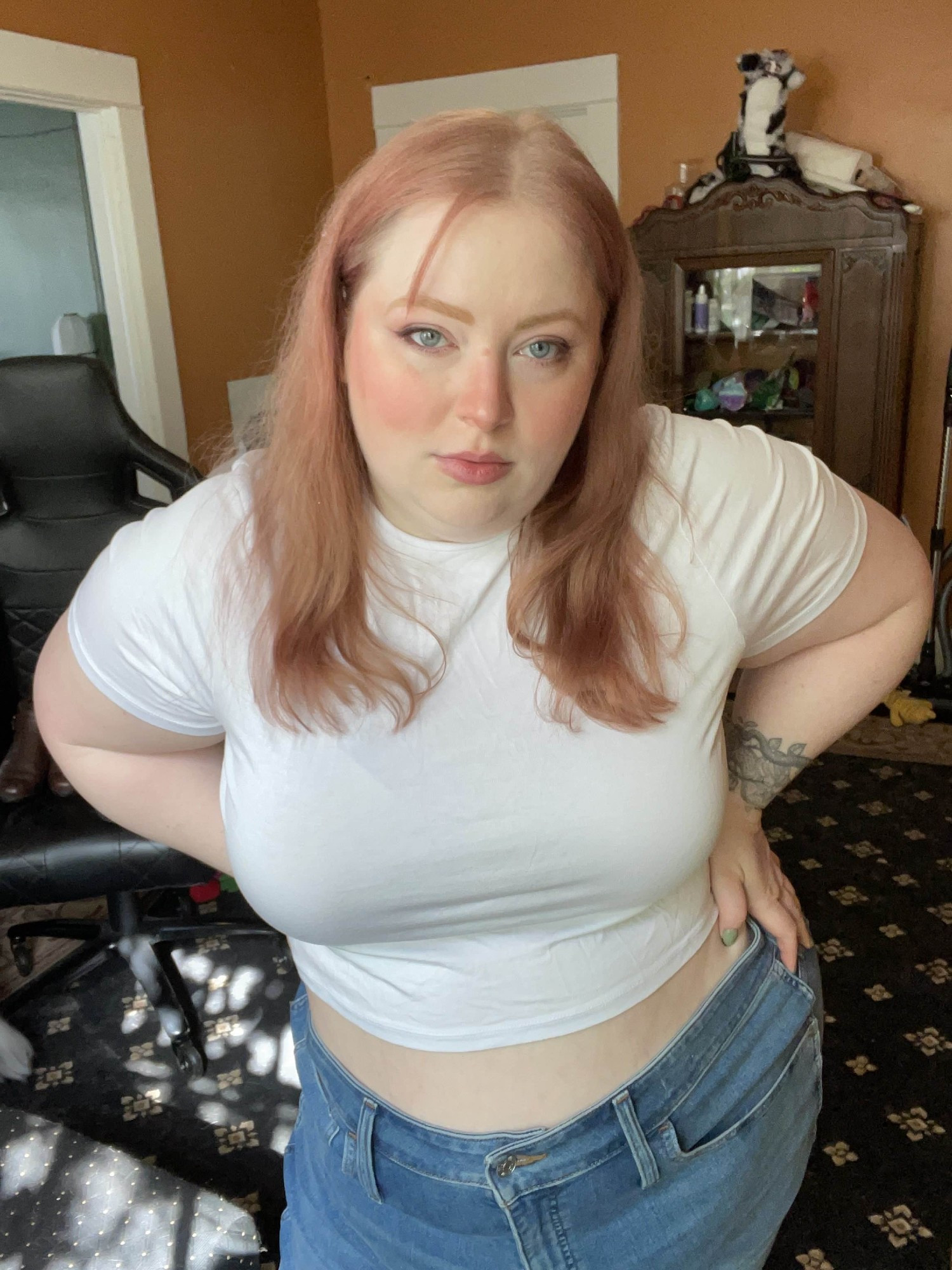 image of a plus size woman modeling a white short sleeve crop top