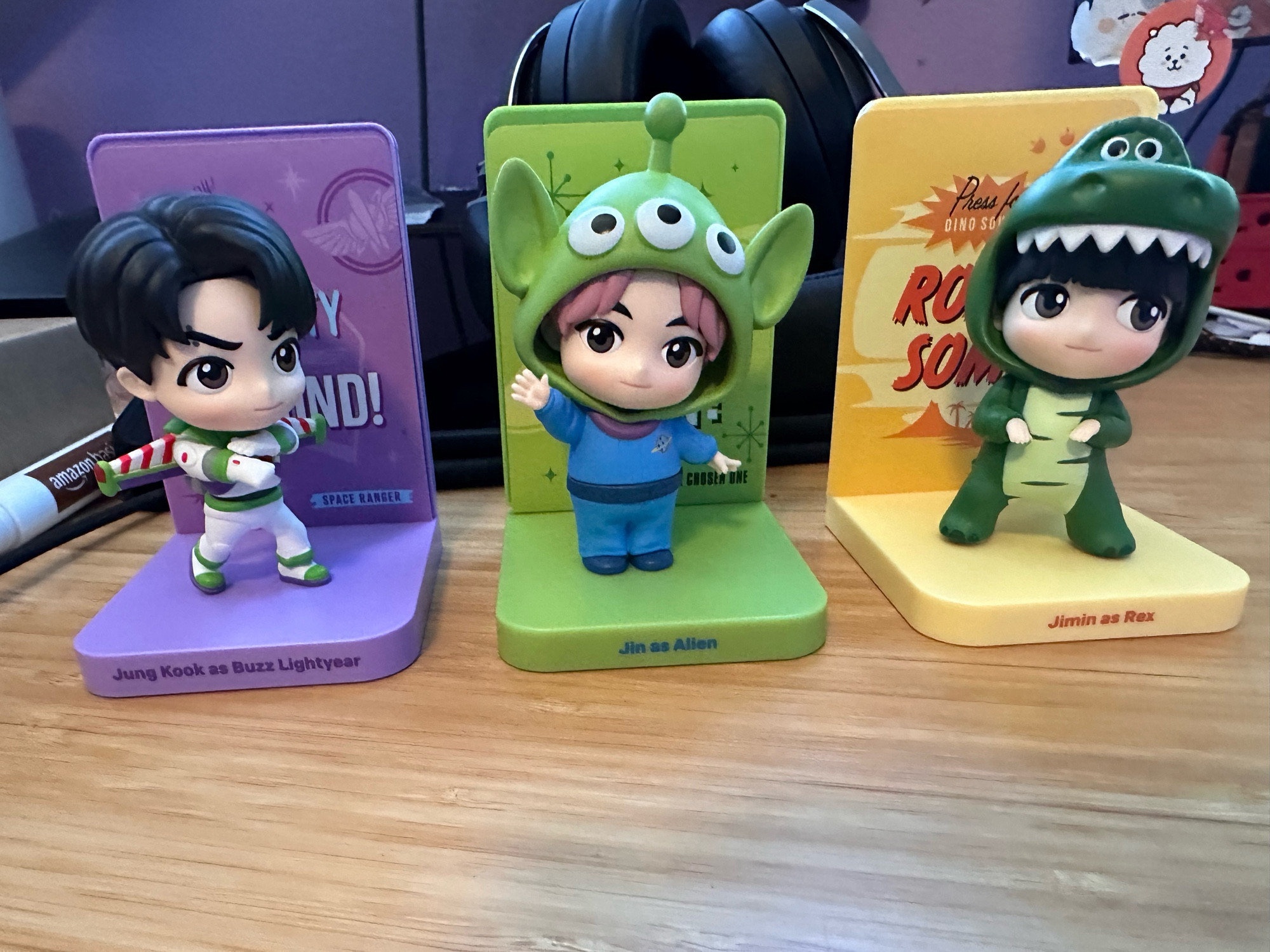 BTS as Toy Story characters. JK as Buzz Lightyear, Jin as Alan and Jimin as Rex